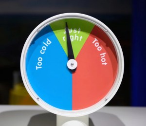 Thermostat dial pointing to 'just right' between too cold and too hot, ideal for emergency AC repair context.