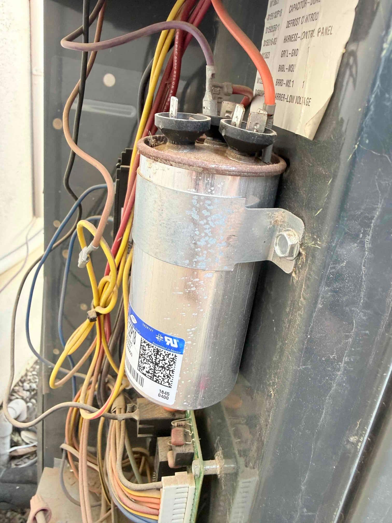 Capacitor installed, showing clean wiring and no signs of damage or corrosion.