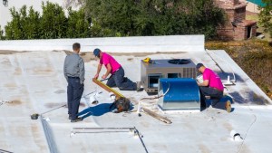 Aerial view of the AZ Perfect Comfort crew replacing a commercial rooftop HVAC unit