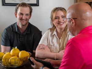 AZ Perfect Comfort advisor reviewing replacement options with homeowners at their kitchen table