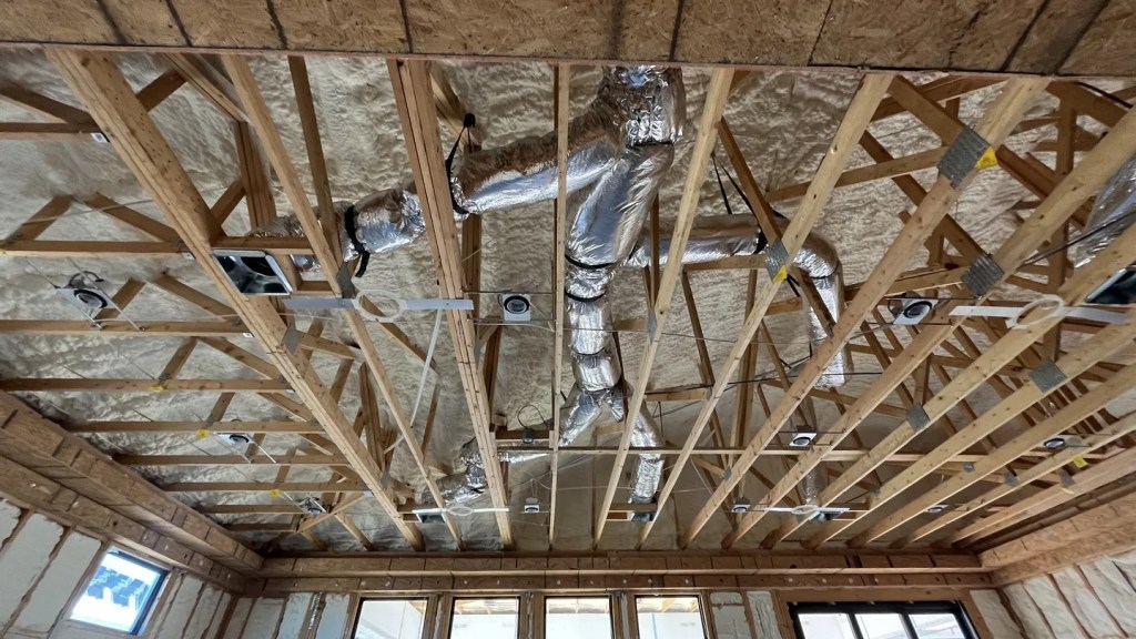 AZ Perfect Comfort technician inspecting residential ductwork