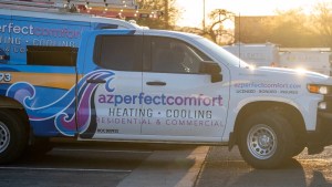 AZ Perfect Comfort service truck parked at a Phoenix job site at sunrise