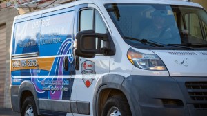 AZ Perfect Comfort technician arriving at a Phoenix-area home in a company service van
