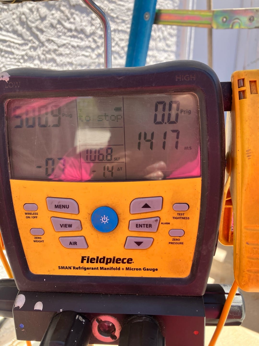Digital manifold with integrated micron gauge shows 0.0 psig on high side and 1417 microns on the vacuum display.