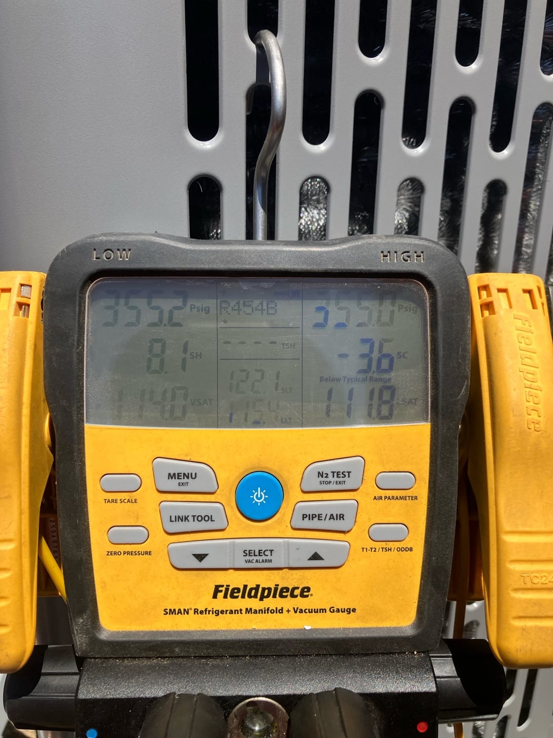 Digital manifold shows equal pressures around 355 psig on both sides during a nitrogen pressure test of the new system.