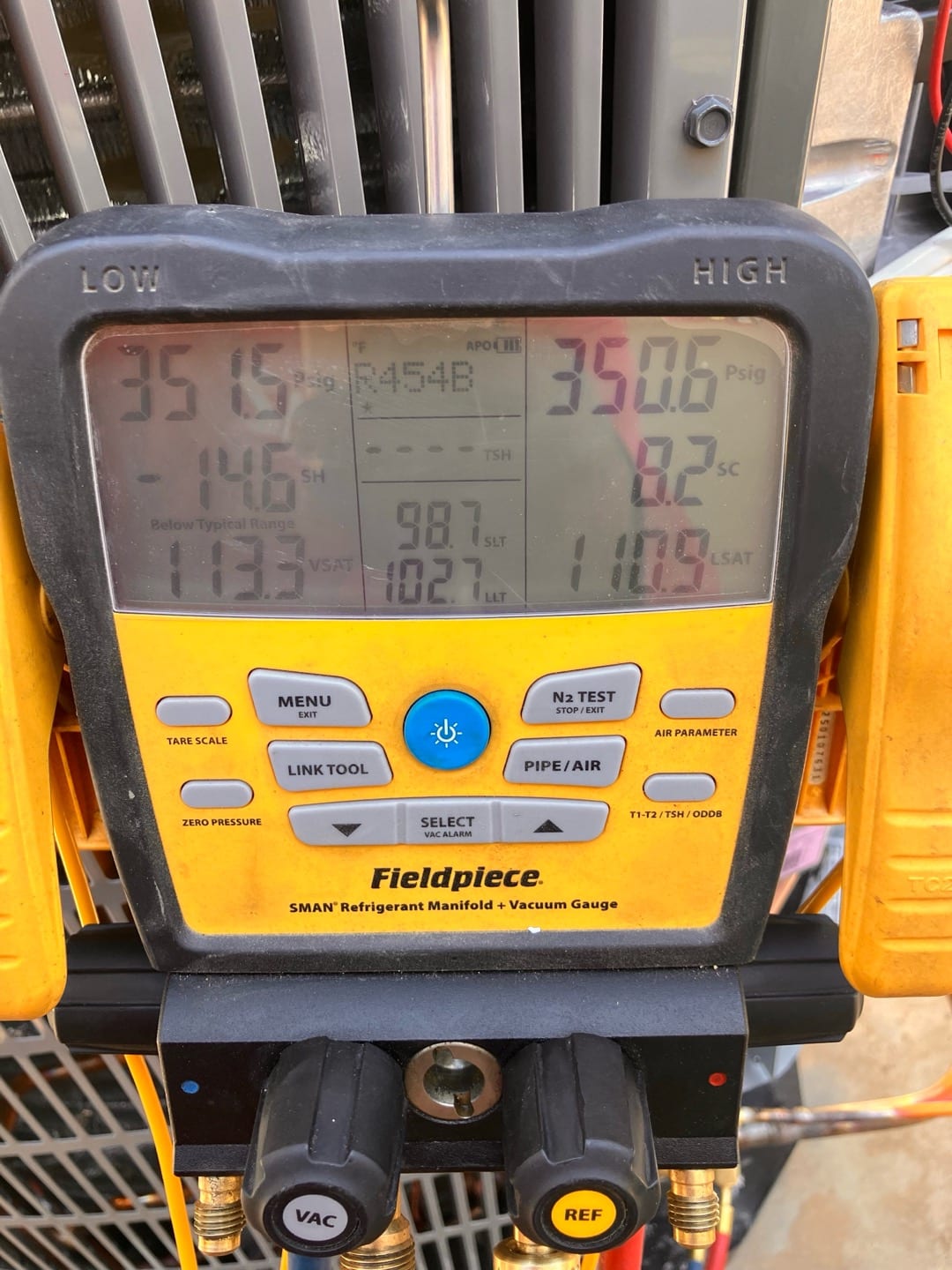 Digital manifold shows equal pressures around 351 PSI on both sides during a nitrogen pressure test of the new system.