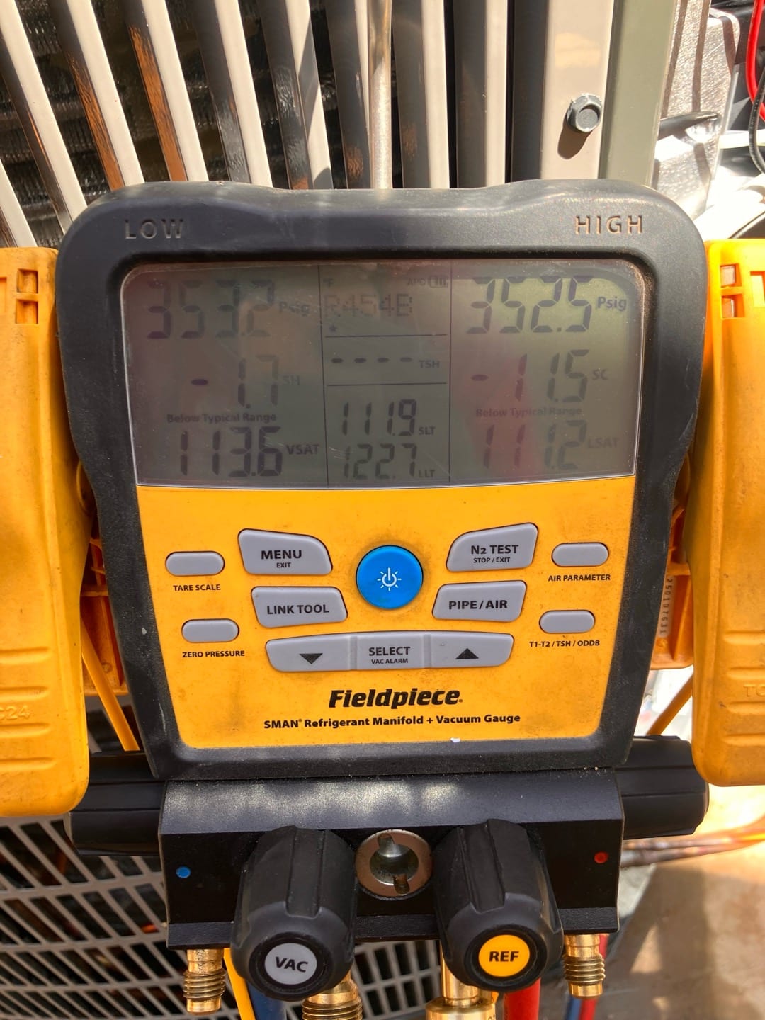 Digital manifold shows equal pressures around 352–353 PSI on both sides during a nitrogen pressure test on the new system.