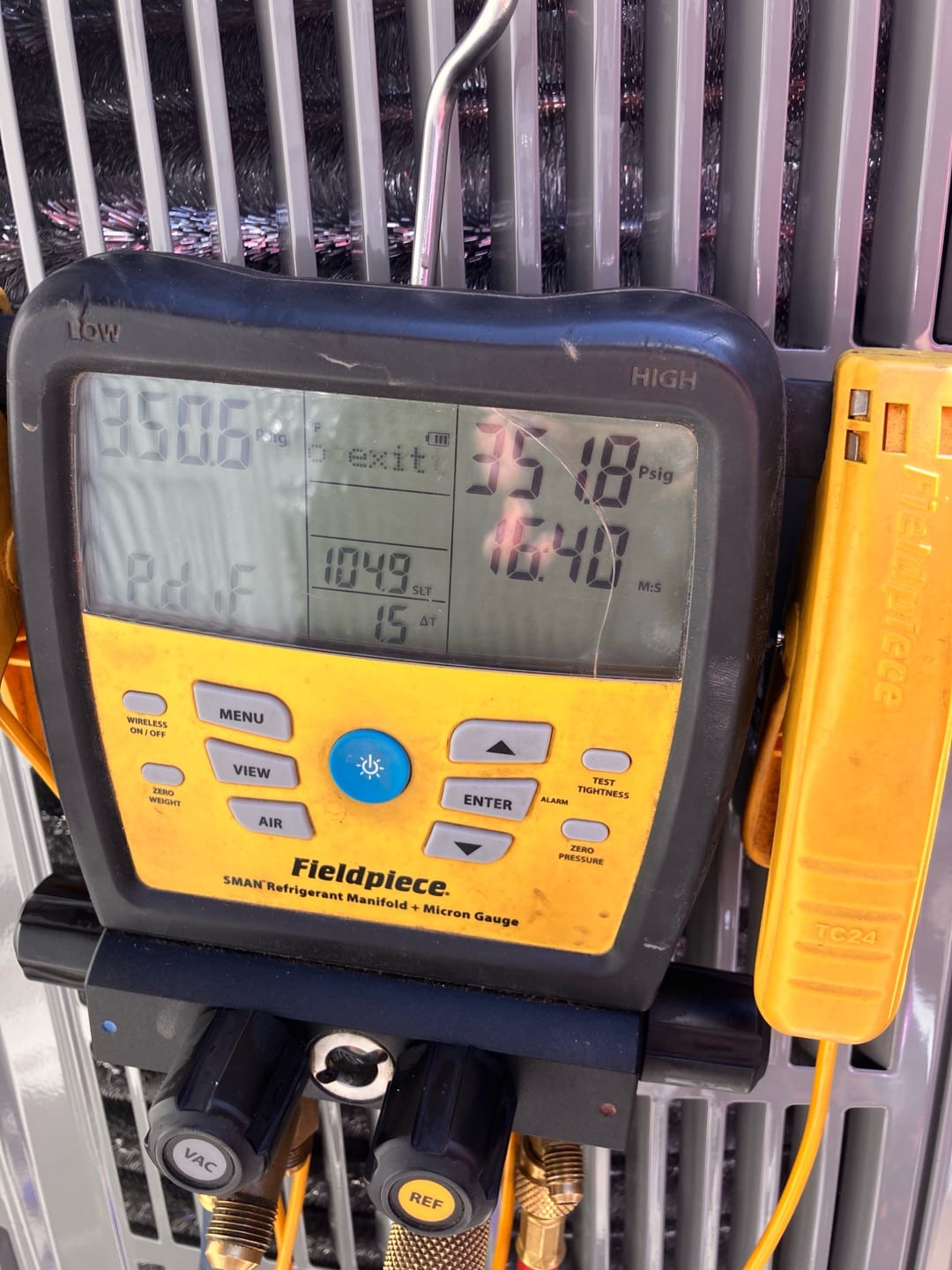 Digital manifold shows equalized pressures near 351 PSI on both sides during a nitrogen pressure test of the new system.