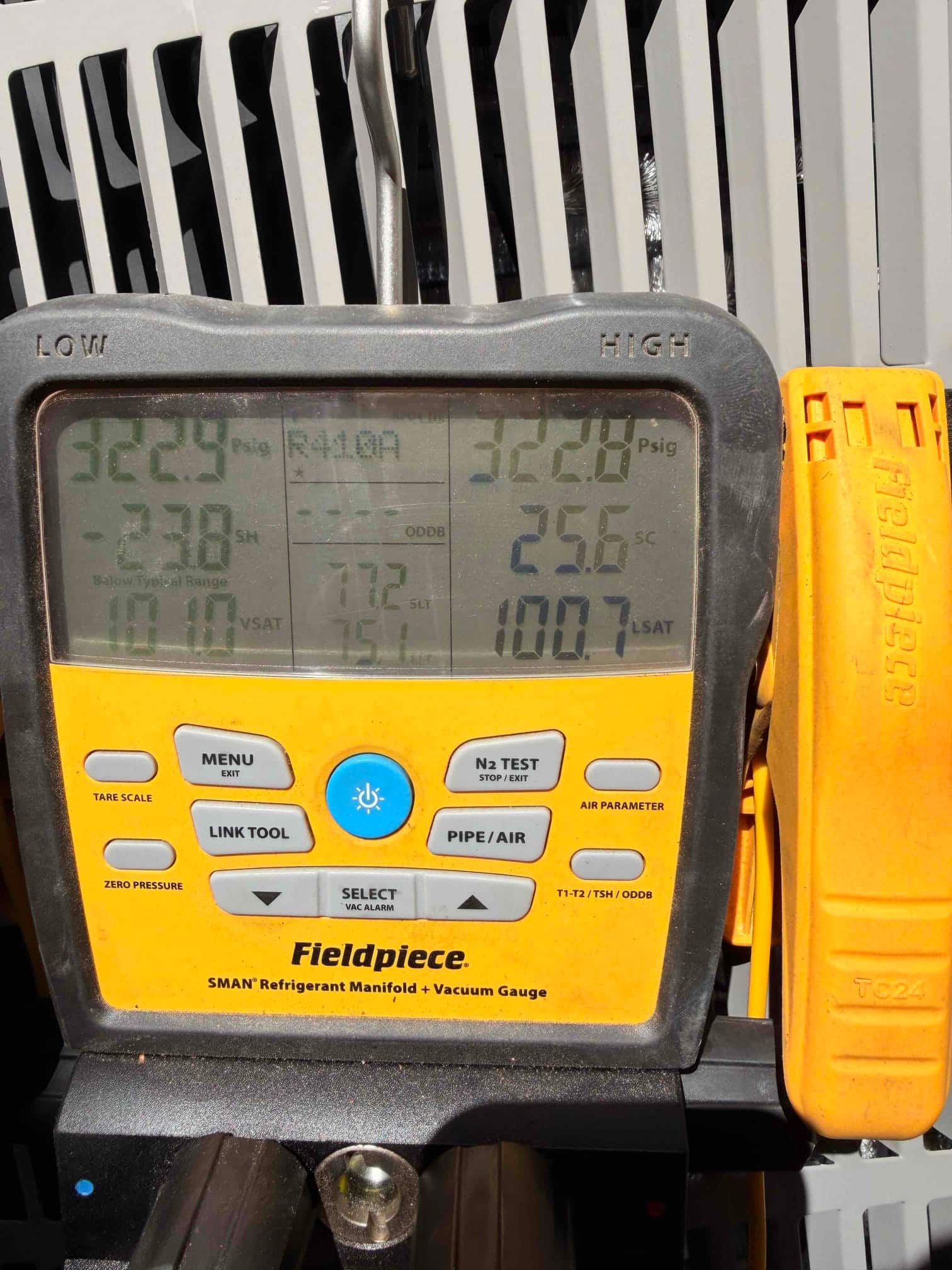 Digital manifold shows both low and high gauges holding equal pressure during a nitrogen pressure test on the new system.
