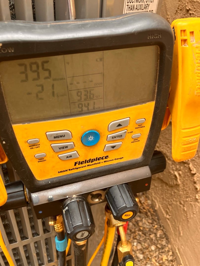 Digital manifold shows equalized pressures at 395 PSI on both sides during a nitrogen pressure test on the new system.
