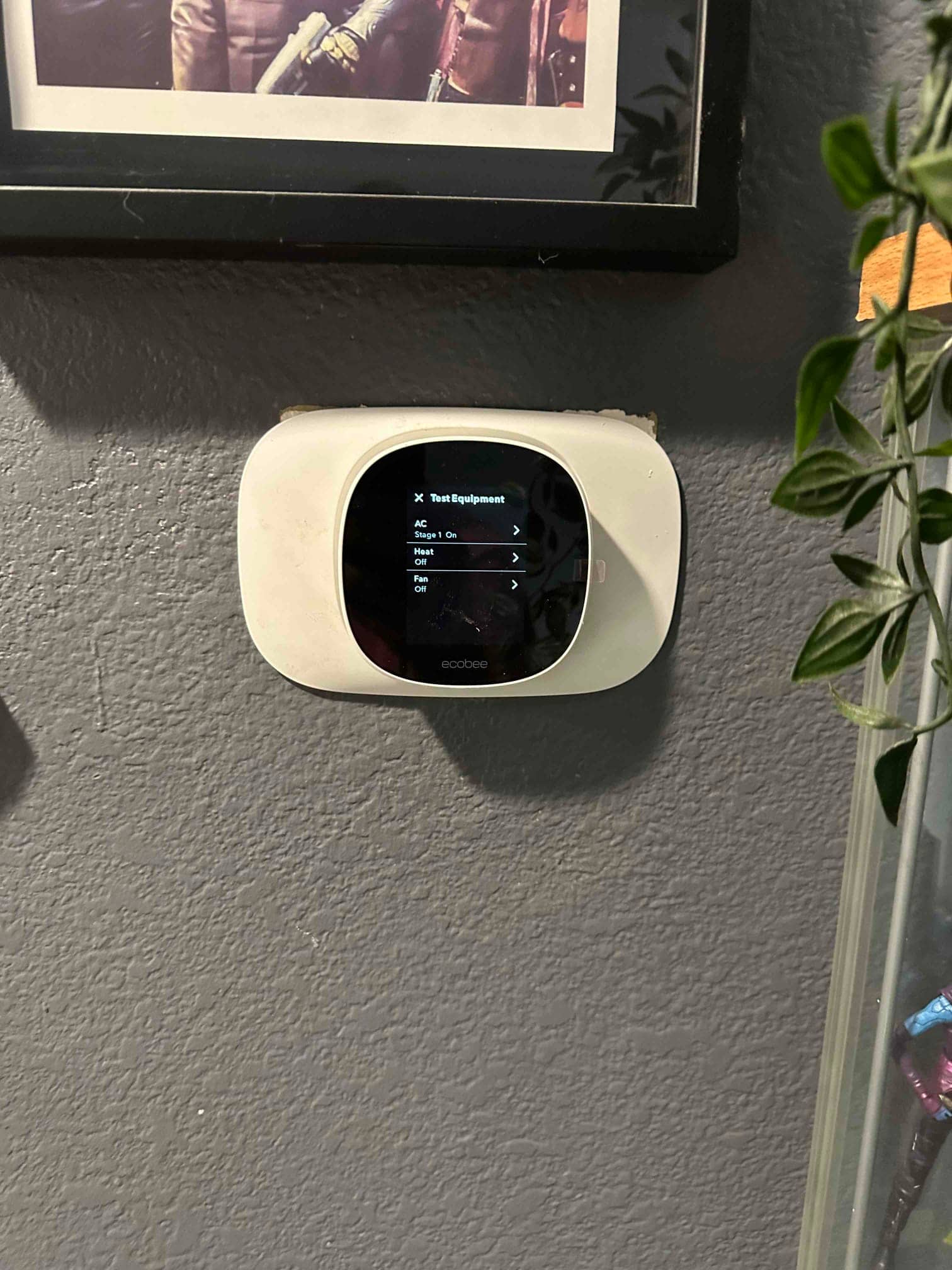 Wall-mounted smart thermostat on the Test Equipment screen, used to control cooling, heating, and fan during commissioning.