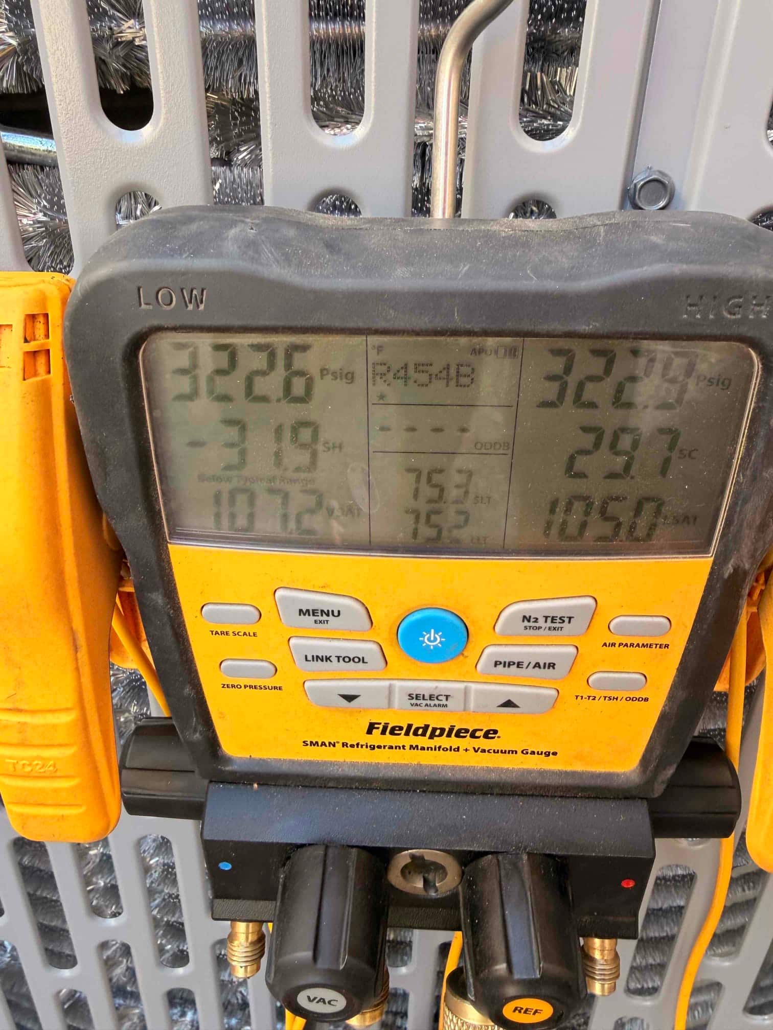 Digital manifold shows equal pressures around 322 PSI on both sides during a nitrogen pressure test of the new system.