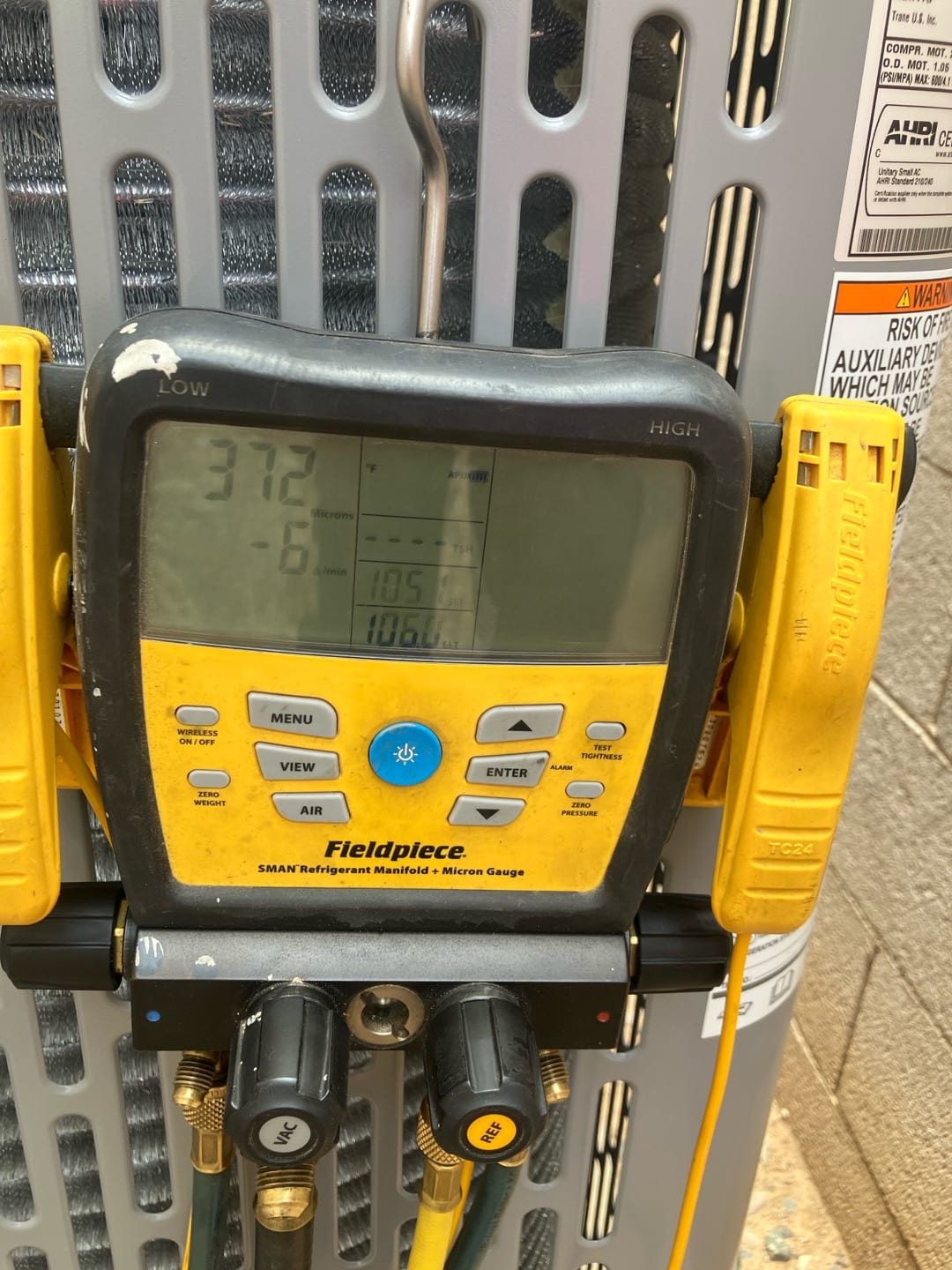 Digital manifold shows equalized pressures around 372 PSI on both sides during a nitrogen pressure test of the new system.
