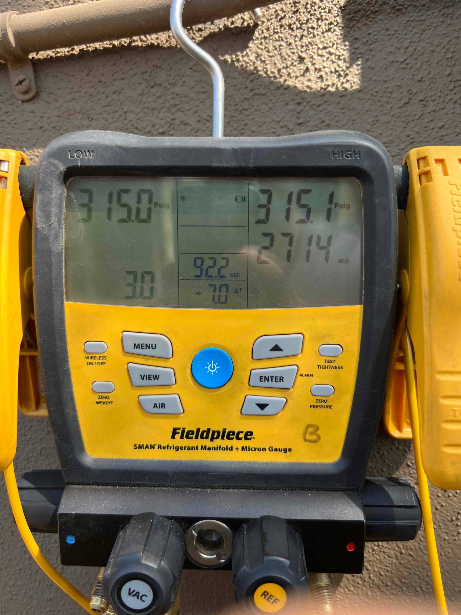 Digital manifold shows equal pressures around 315 PSI on both sides during a nitrogen pressure test of the new system.