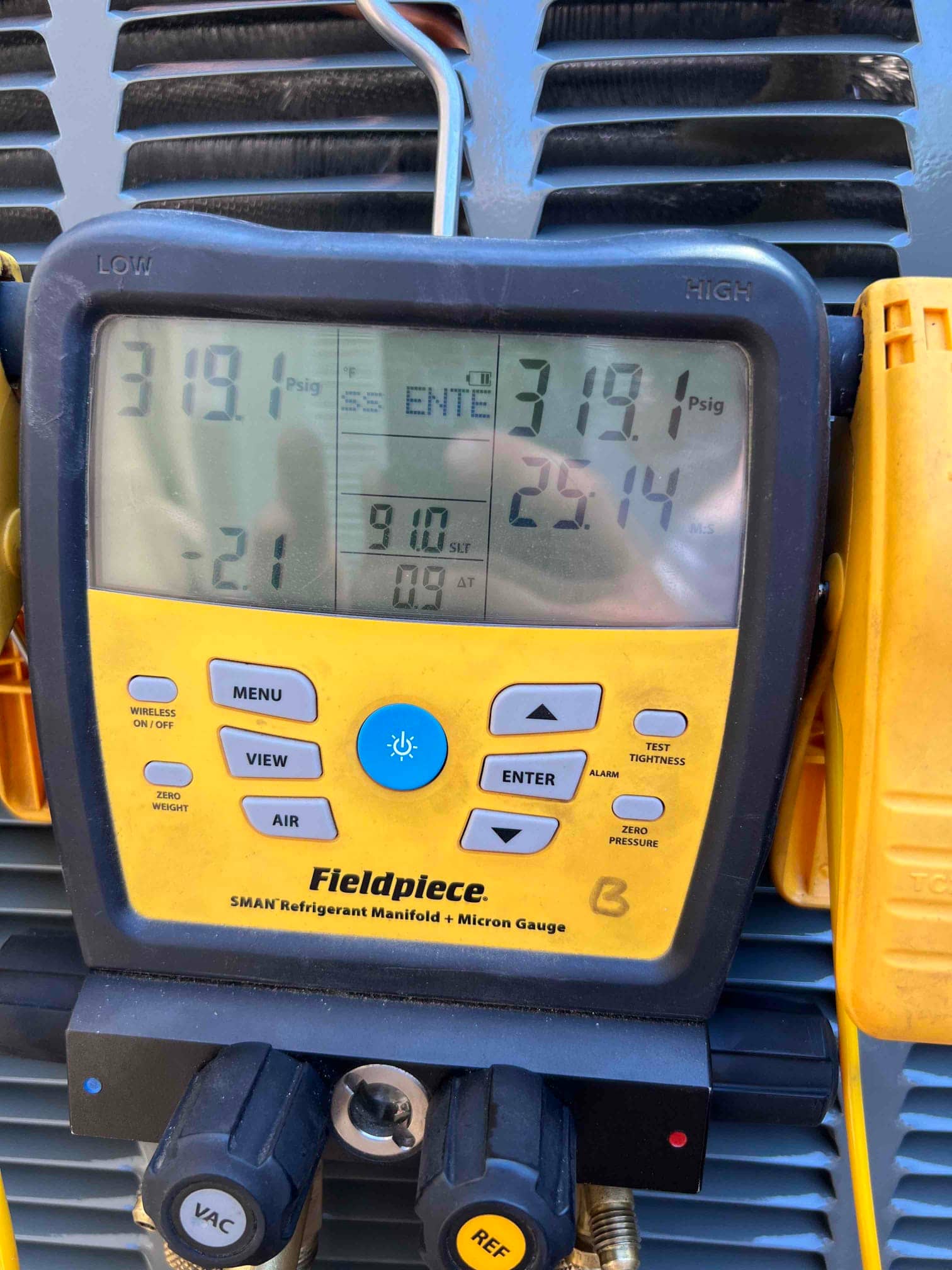 Digital manifold shows equal pressures of 319 PSI on both sides during a nitrogen pressure test of the new system.