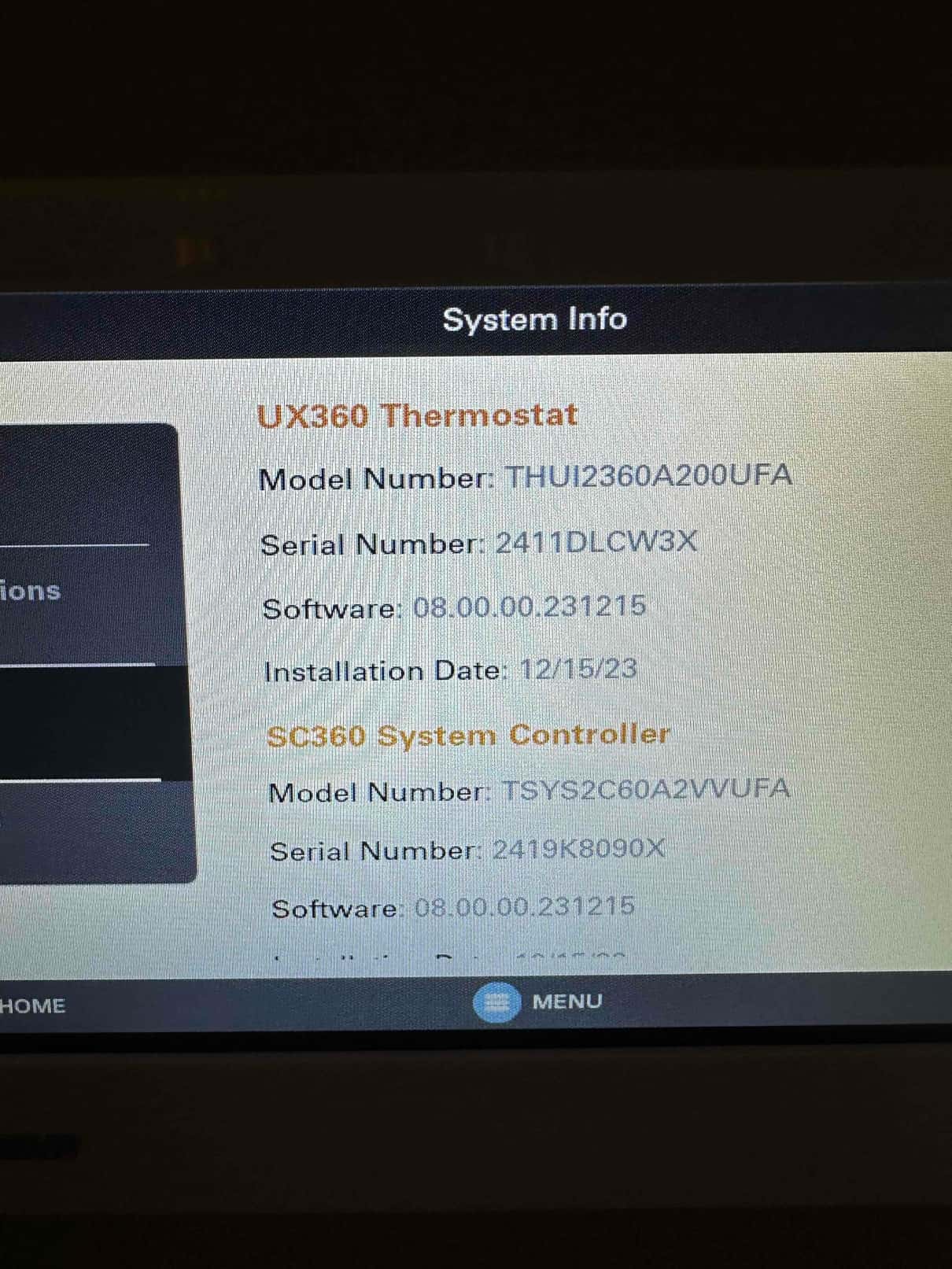 Thermostat screen displays system information including model numbers, serial numbers, software version, and installation date.
