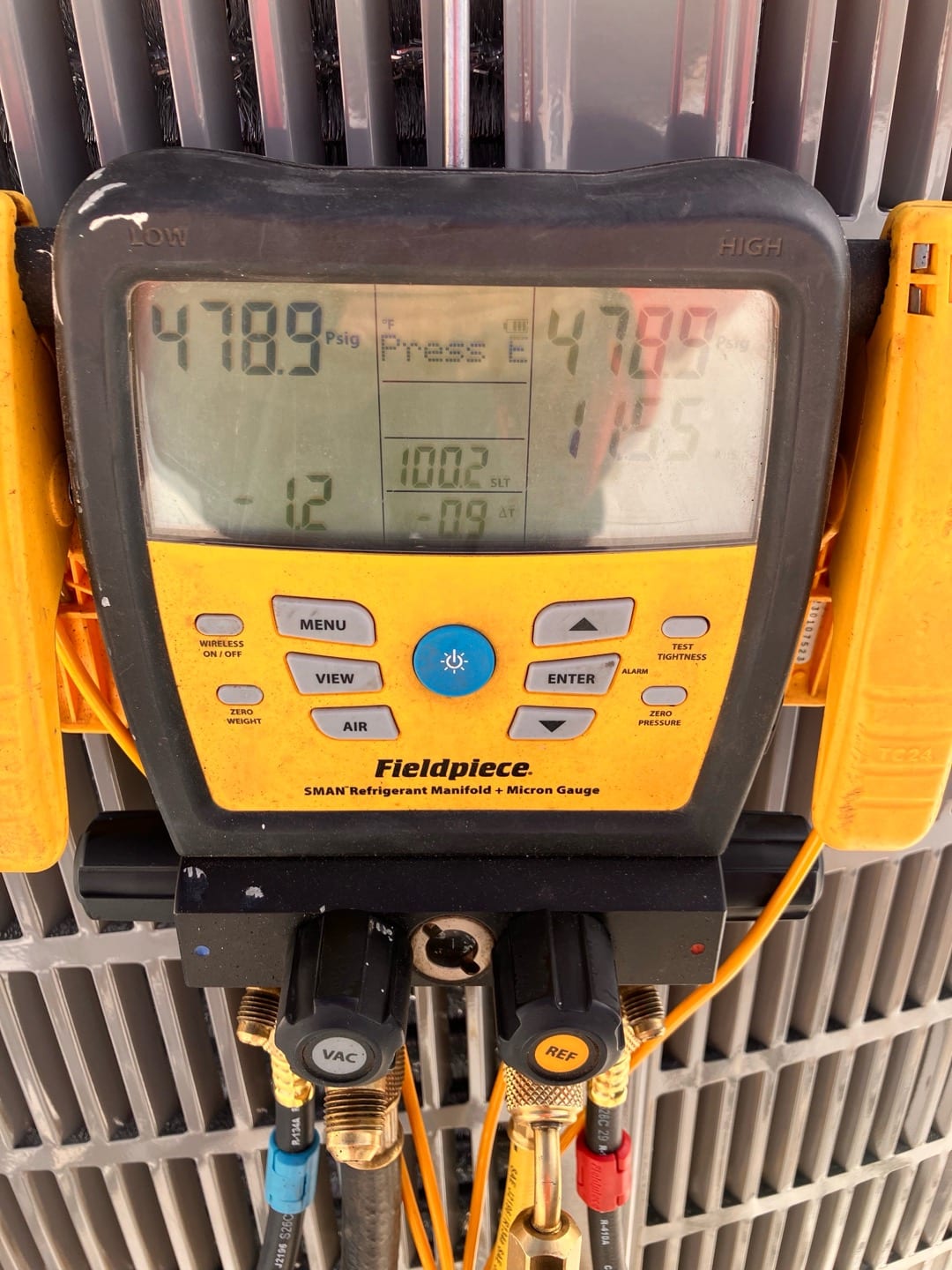 Digital manifold shows equal pressure around 479 PSI on both sides, documenting a nitrogen pressure test on the new system.