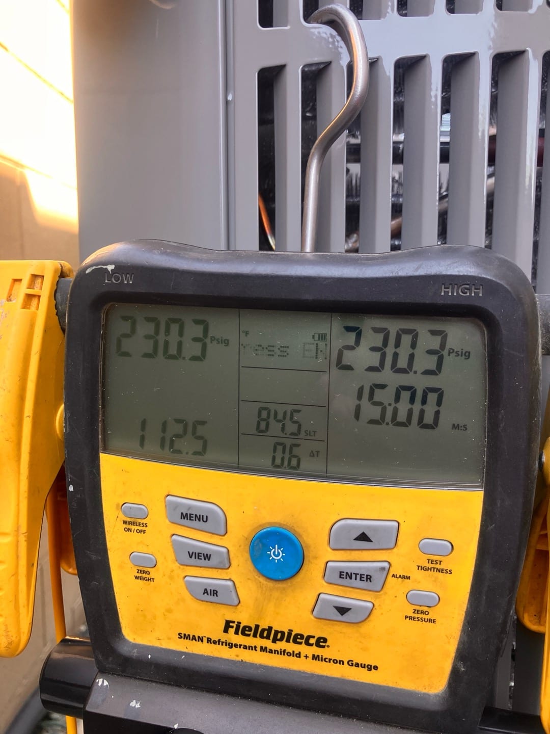 Digital manifold shows equal pressures of 230 PSI on both low and high sides during the nitrogen pressure test.