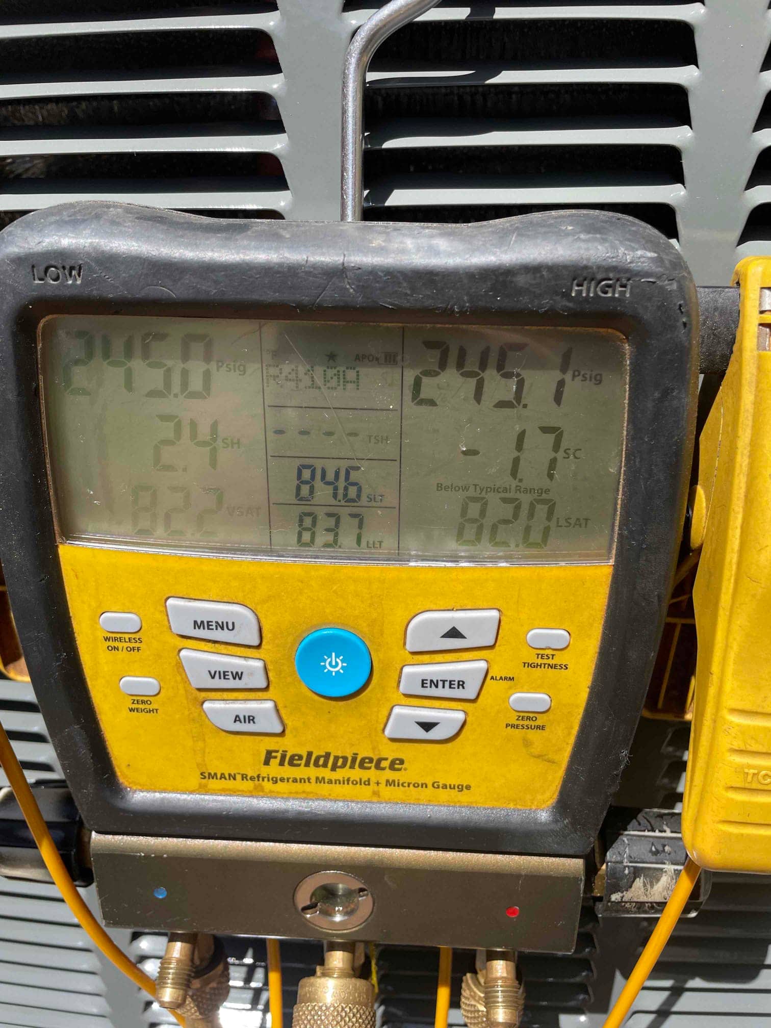 Digital manifold shows equal pressures around 245 PSI on both high and low sides during a nitrogen pressure test.