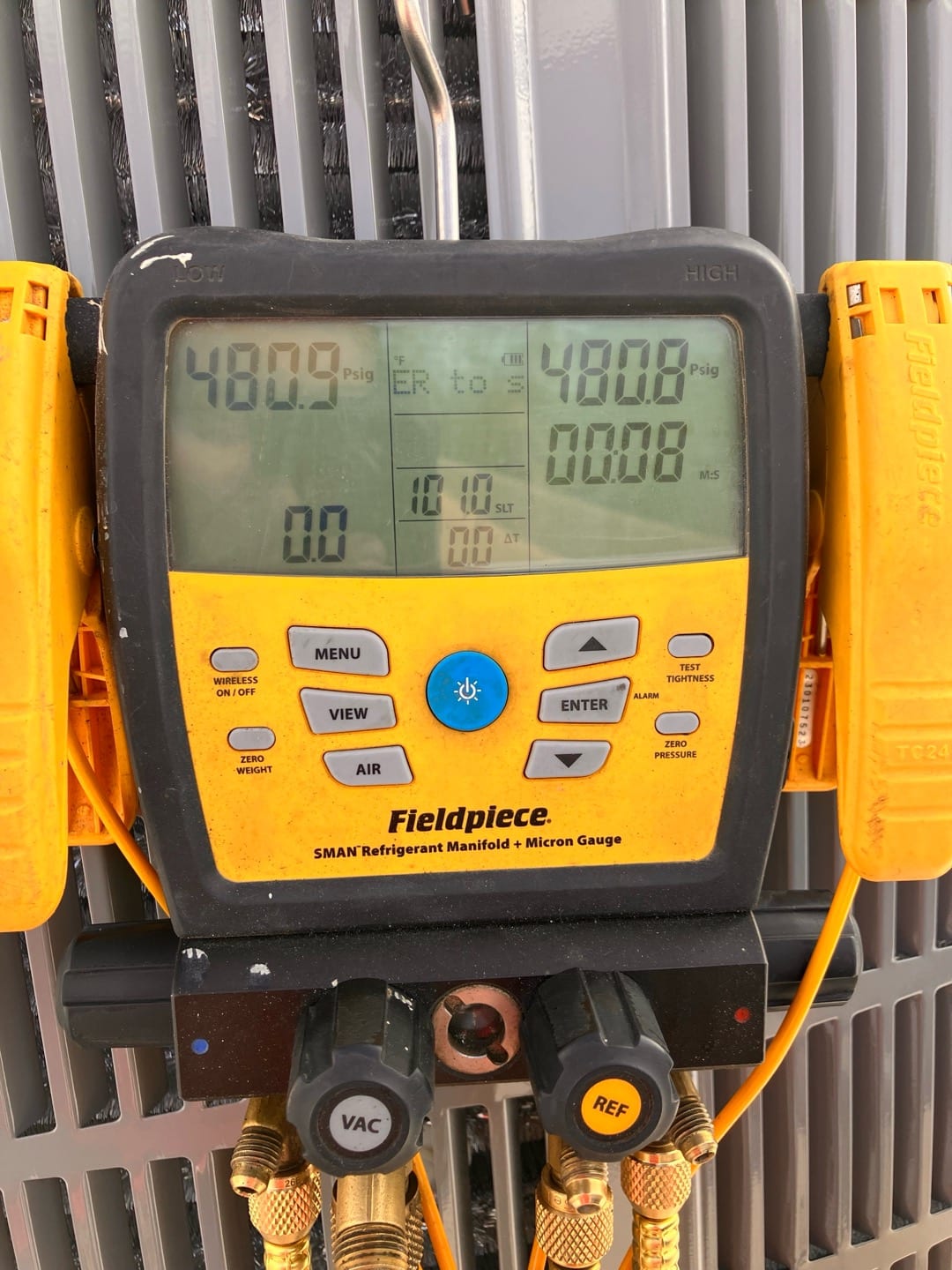 Digital manifold shows equal pressures around 480 PSI on both sides during a nitrogen pressure test of the new system.