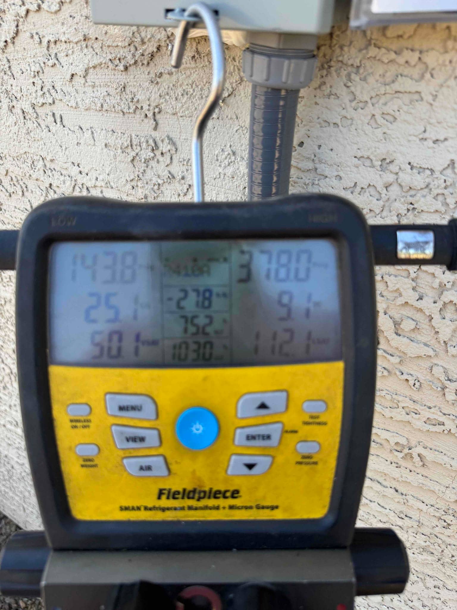 Digital manifold shows both high and low sides holding equal pressure during a nitrogen pressure test on the new system.