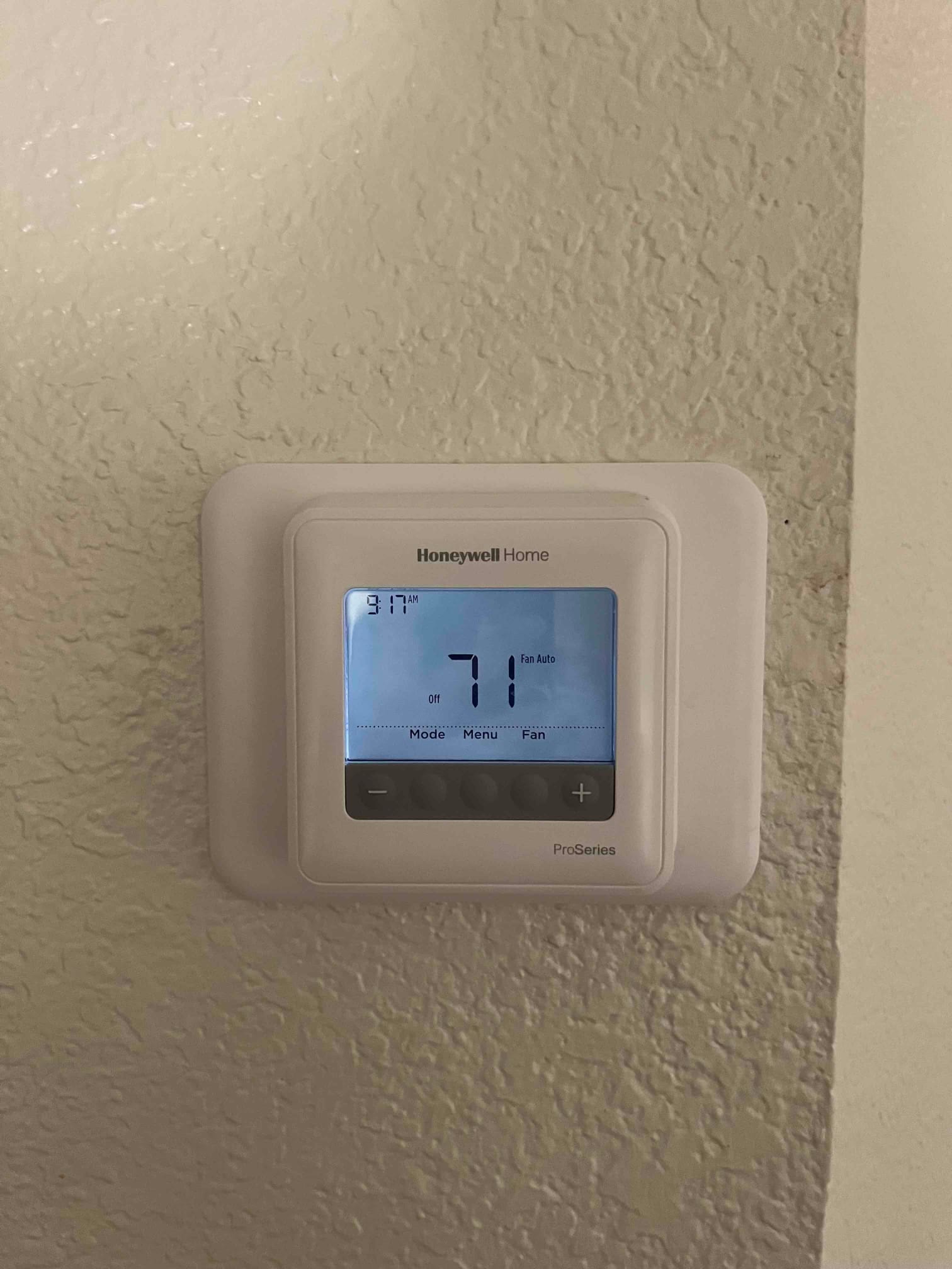 Digital thermostat display shows indoor temperature at 71 °F with system set to off and fan on auto.
