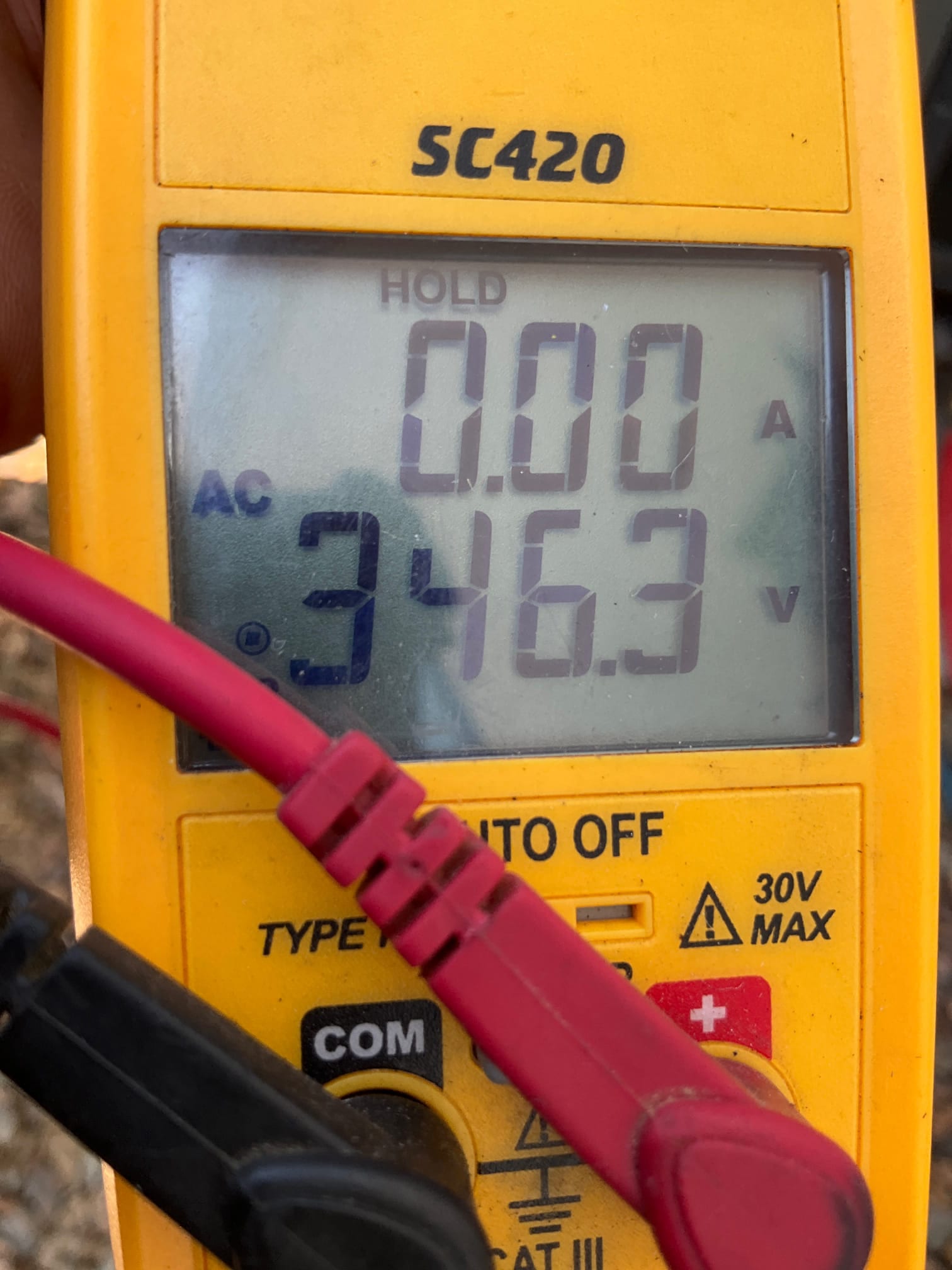 HVAC diagnostic instrument photographed during the service visit.