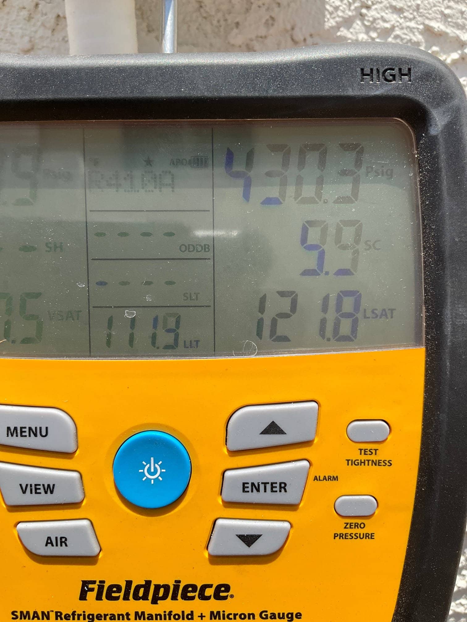 HVAC diagnostic instrument photographed during the service visit.