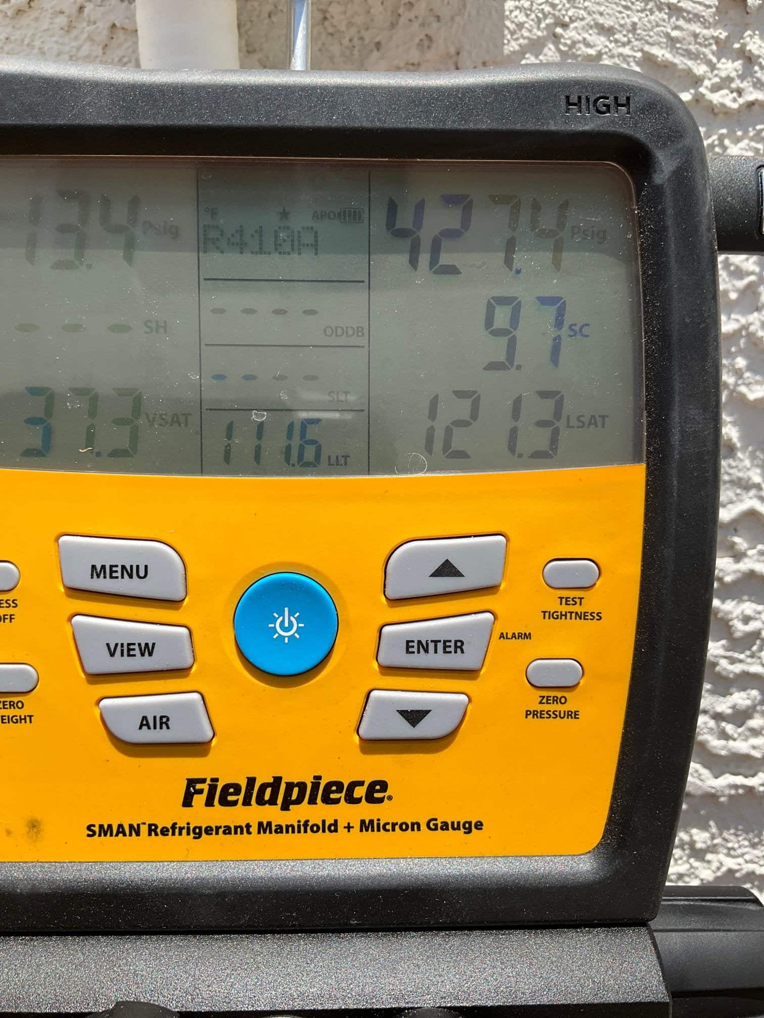 HVAC diagnostic instrument photographed during the service visit.