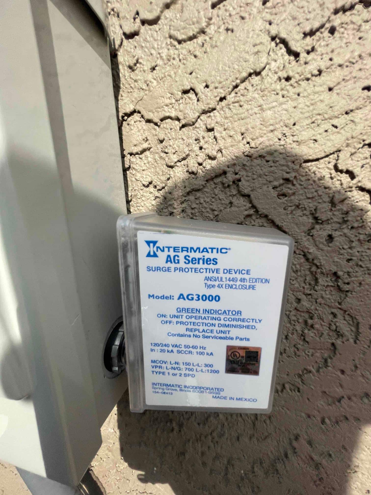 Surge protective device installed at the outdoor disconnect, providing overvoltage protection for the new HVAC condenser circuit.