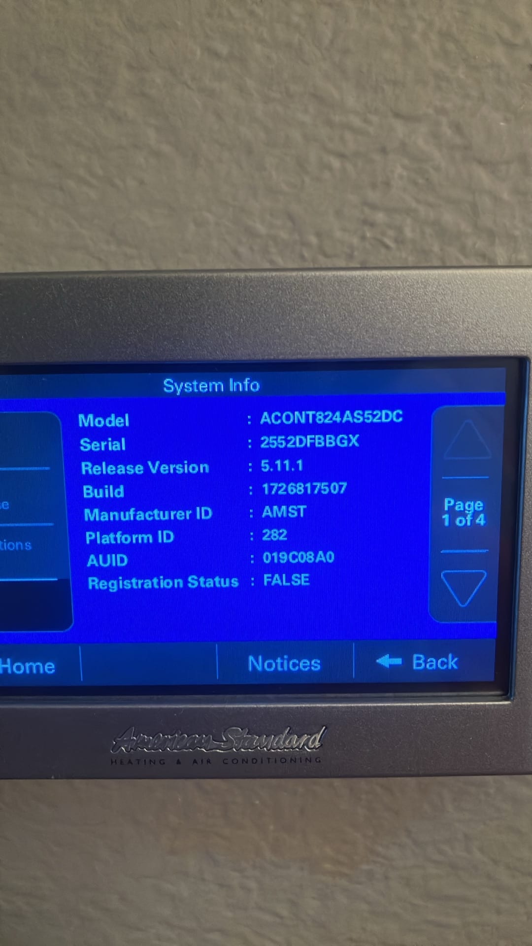 Thermostat system information screen displayed during setup, showing software version and device identifiers after the new HVAC installation.
