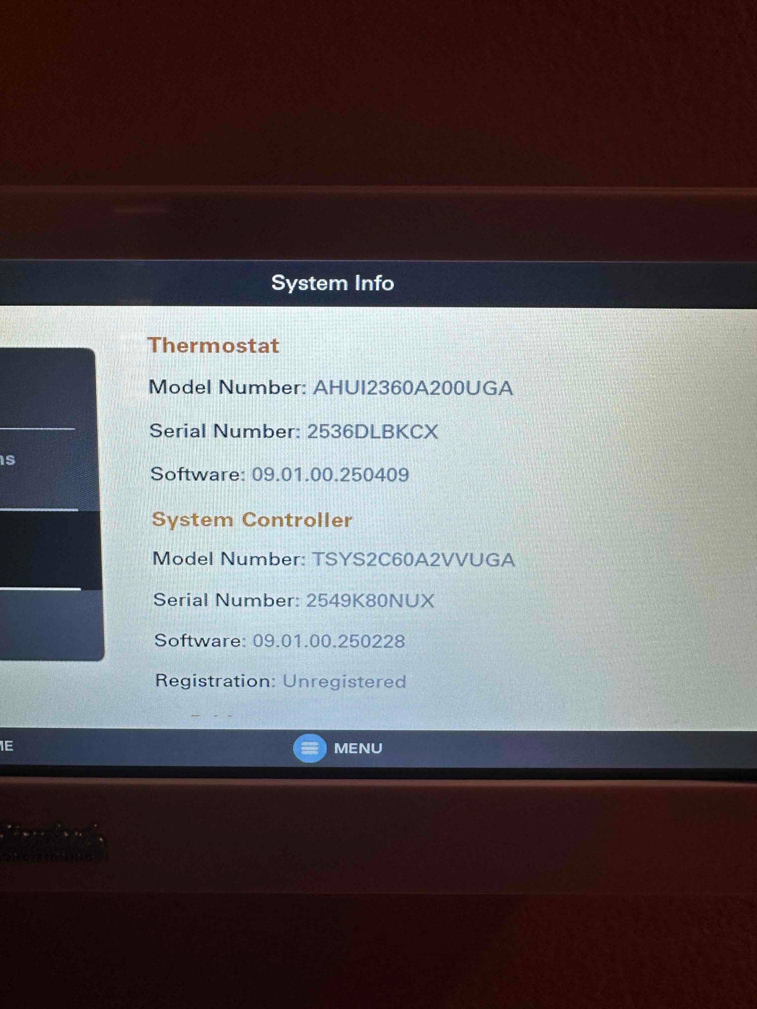 Thermostat system information screen displays model, serial numbers, software versions, and registration status after installation.