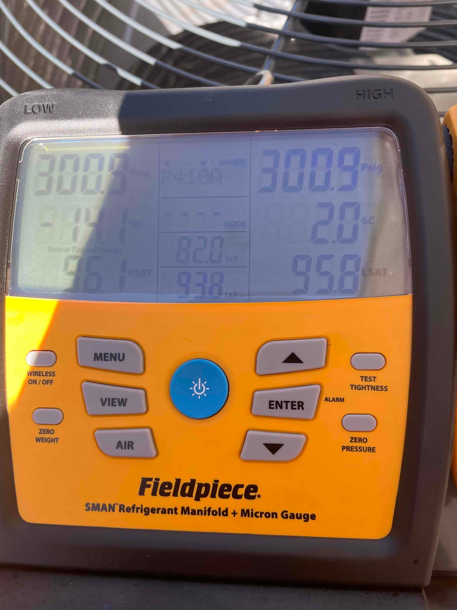 Digital manifold shows equal pressures around 300 PSI on both sides, documenting a nitrogen pressure test on the new system.