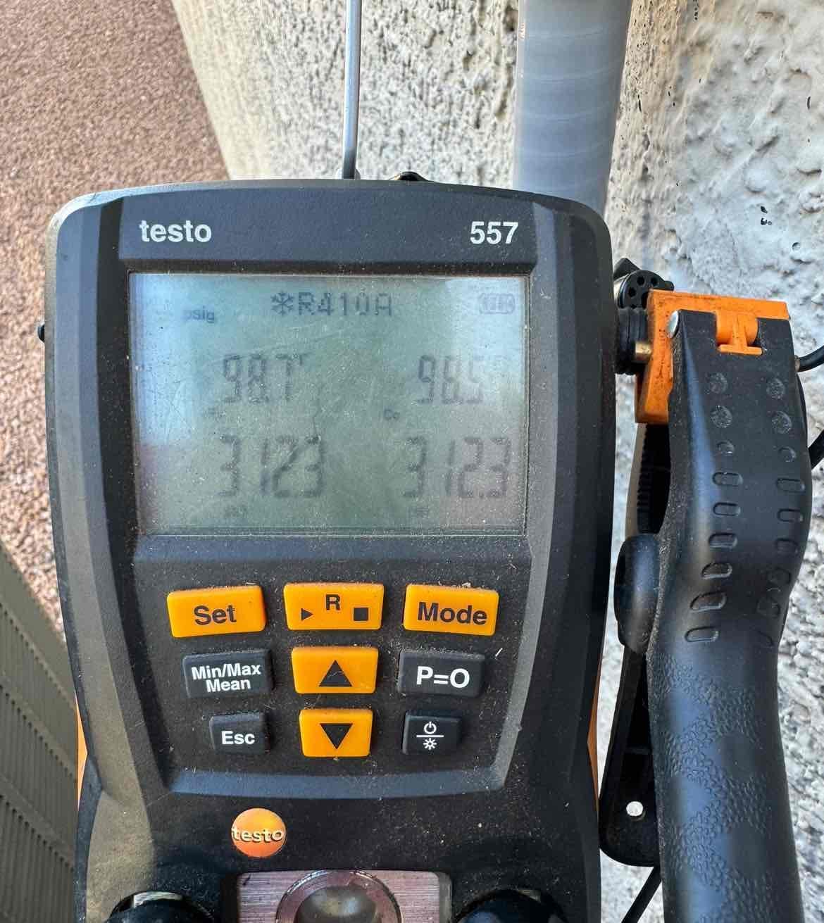 Digital manifold shows both sides holding 3123 psi during a nitrogen pressure test on the newly installed system.