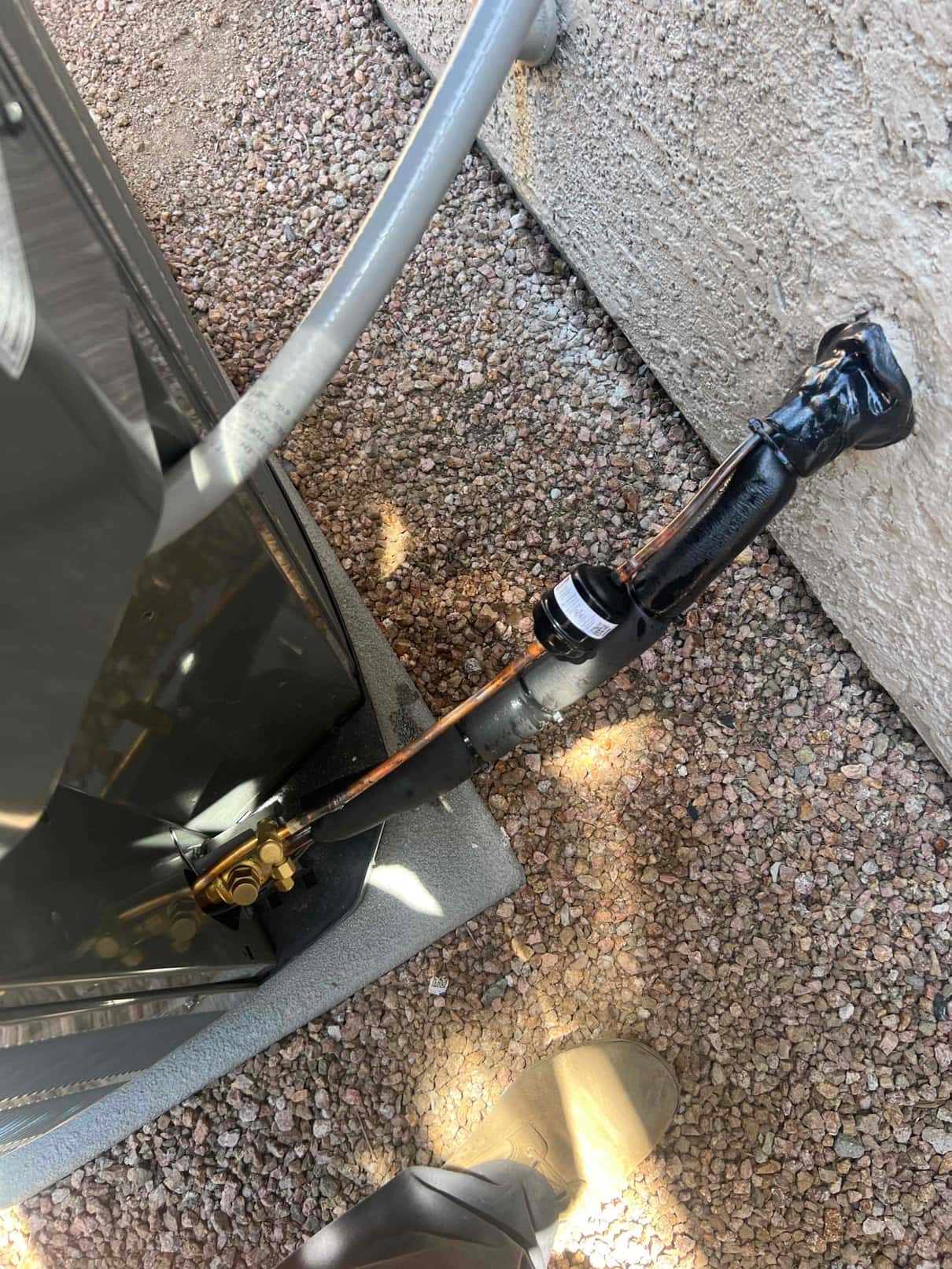 Refrigerant line set and insulated suction line connected at the outdoor condenser service valves on a new installation.