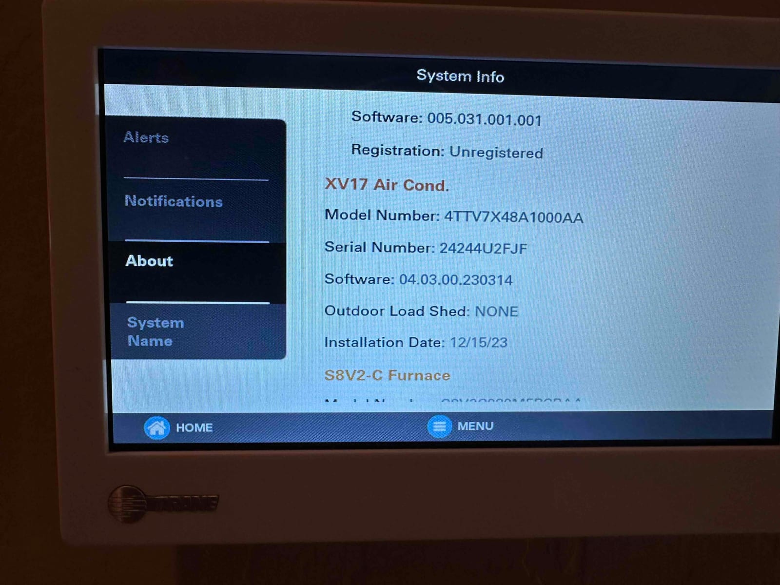 Thermostat screen displays system information menu with equipment details and installation date during setup of the new HVAC system.