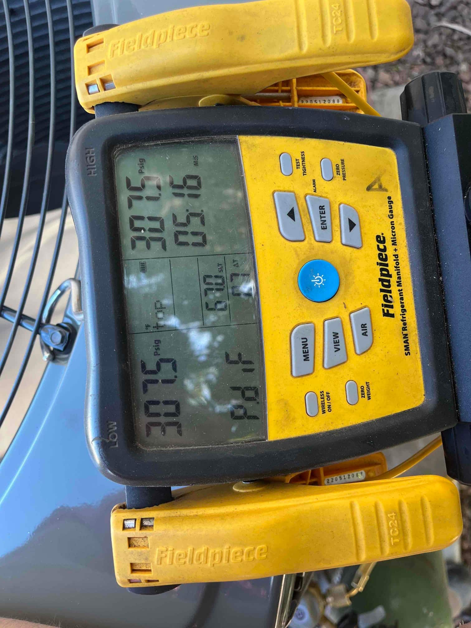 Digital manifold shows equal high and low pressures at 307.5 PSI during a nitrogen pressure test on the new system.