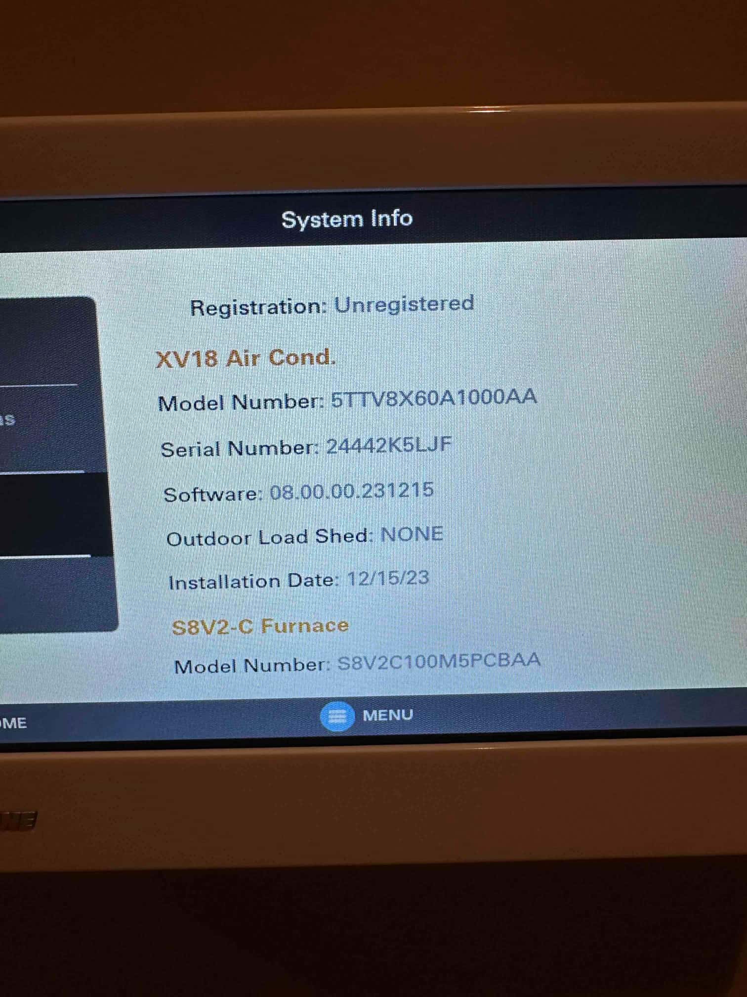 Thermostat system info screen showing equipment registration status, model identifiers, and installation date for the installed HVAC system.
