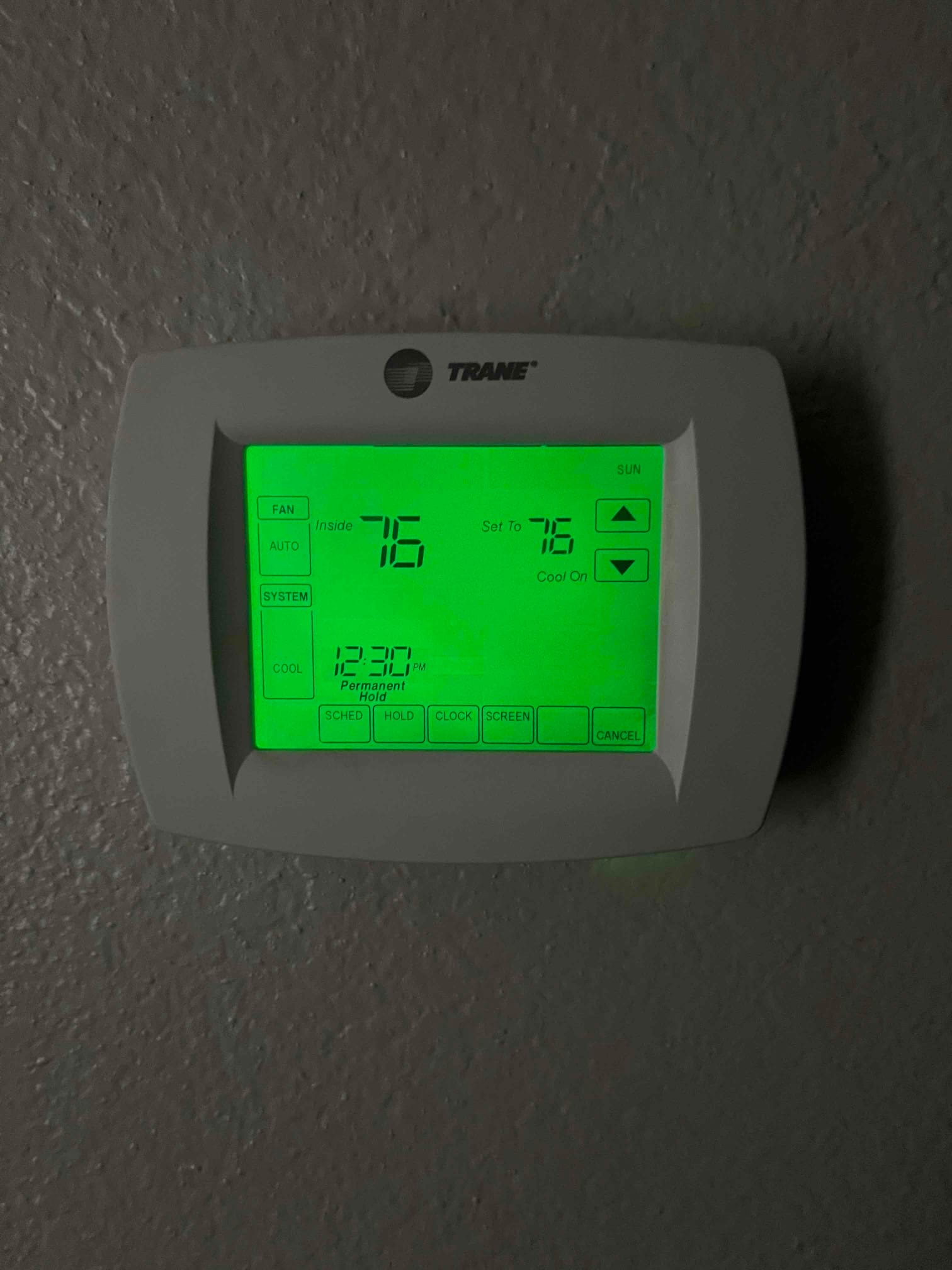 Thermostat display shows indoor temperature 75°F and setpoint 76°F with cooling mode indicated.