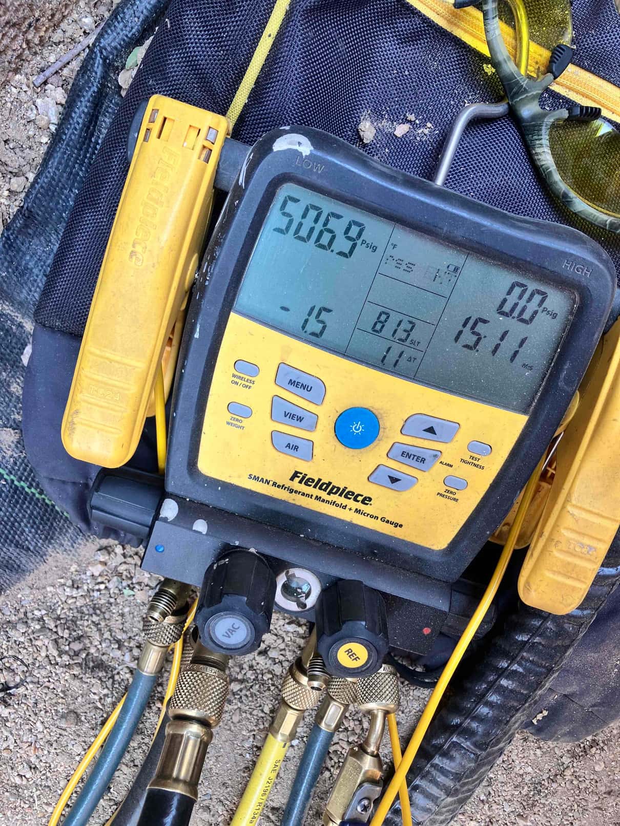 Digital manifold gauges show equalized high pressure on both sides during a nitrogen pressure test of the new system.