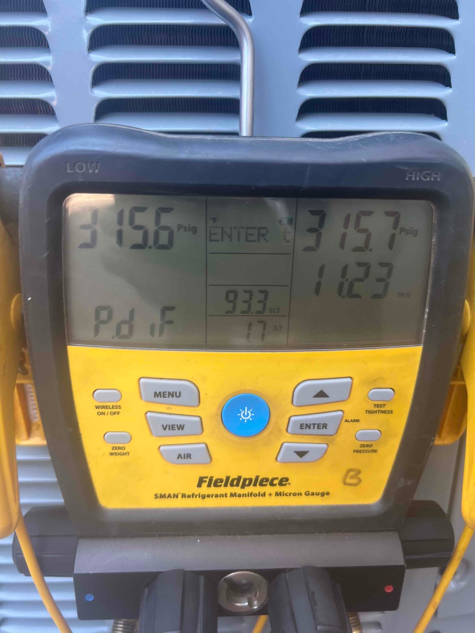 Digital manifold shows equal pressures around 316 PSI on both sides during a nitrogen pressure test of the system.