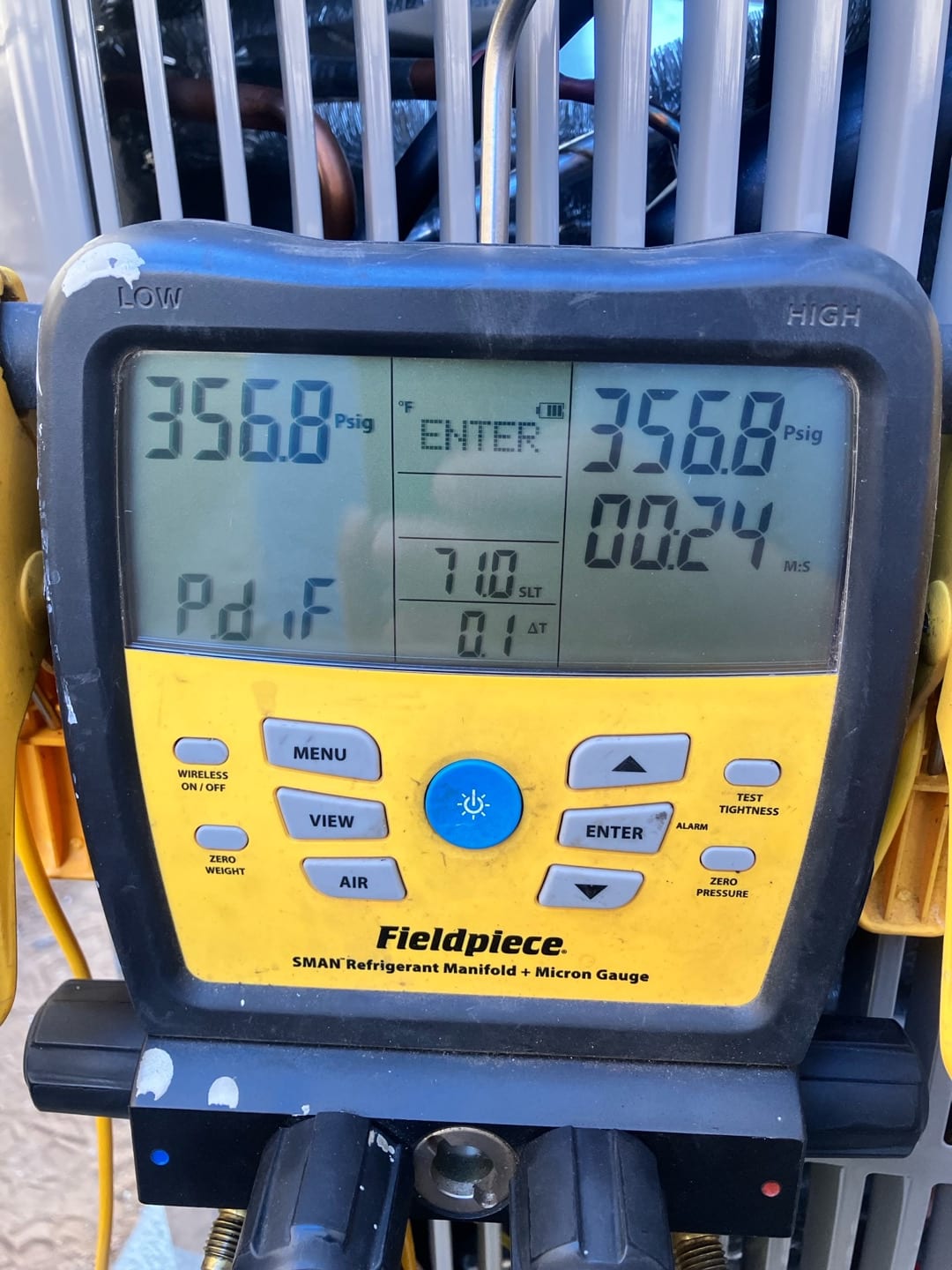 Digital manifold shows equal pressures of 356.8 PSI on both low and high sides during a nitrogen pressure test.