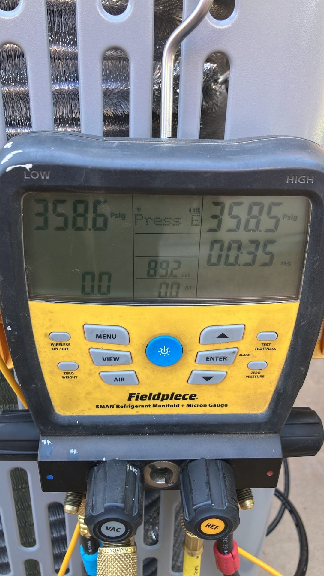 Digital manifold shows equal pressures of 358 PSI on both sides during a nitrogen pressure test of the new system.