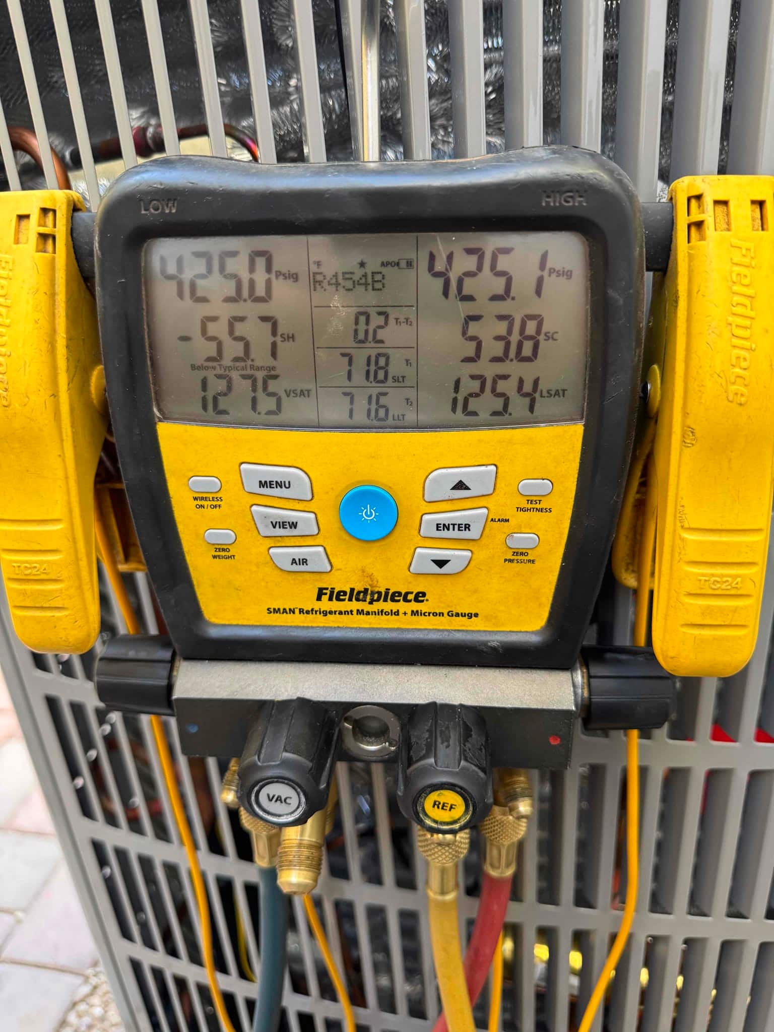 Digital manifold shows equal pressures around 425 PSI on both sides during a nitrogen pressure test of the new system.