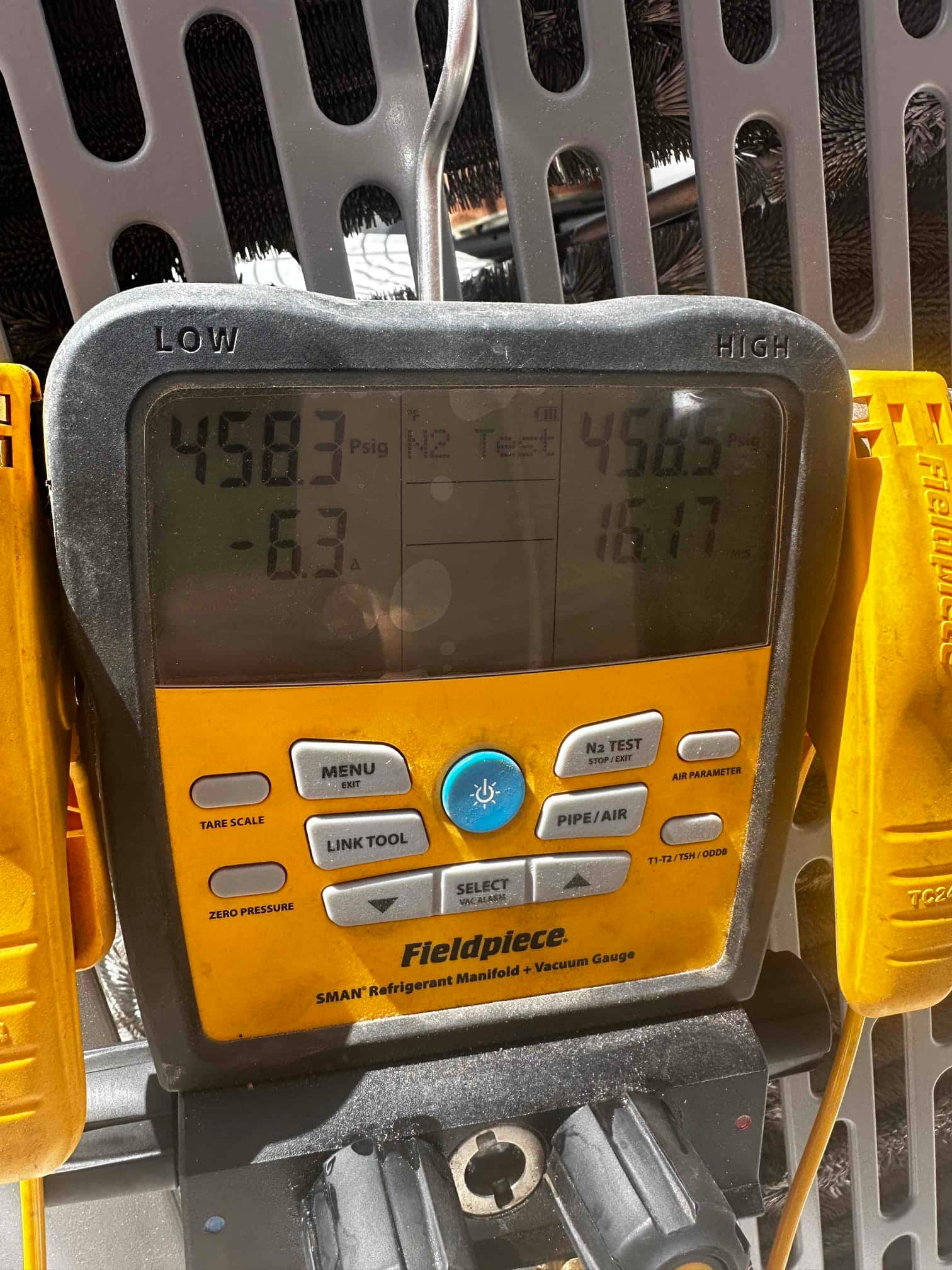 Digital manifold shows equal pressures around 458 PSI on both sides during the nitrogen pressure test of the new system.
