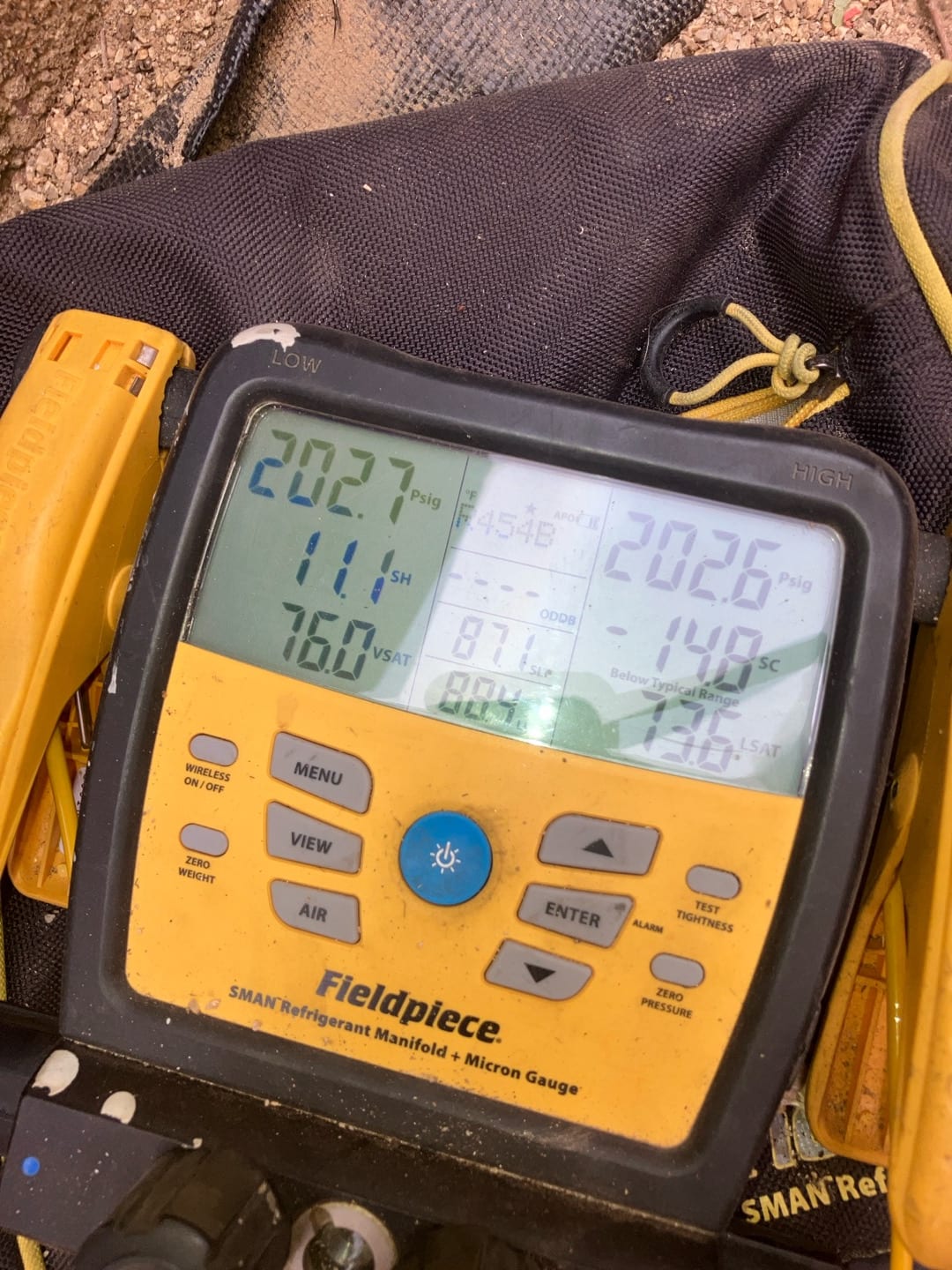 Digital manifold shows equal pressures on both sides during a nitrogen pressure test of the newly installed system.