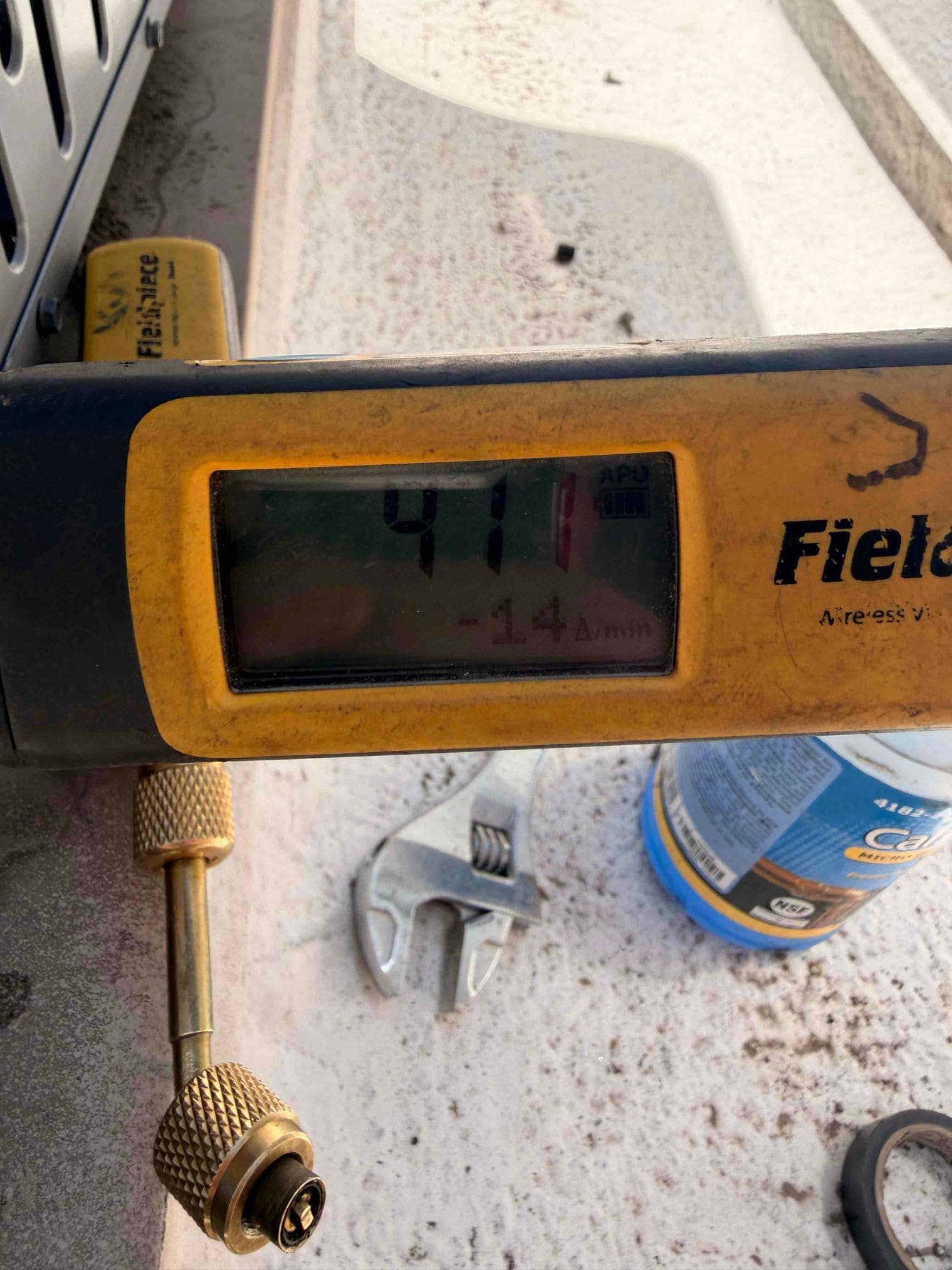 Digital manifold shows equalized pressure at 411 PSI during the nitrogen pressure test of the newly installed system.