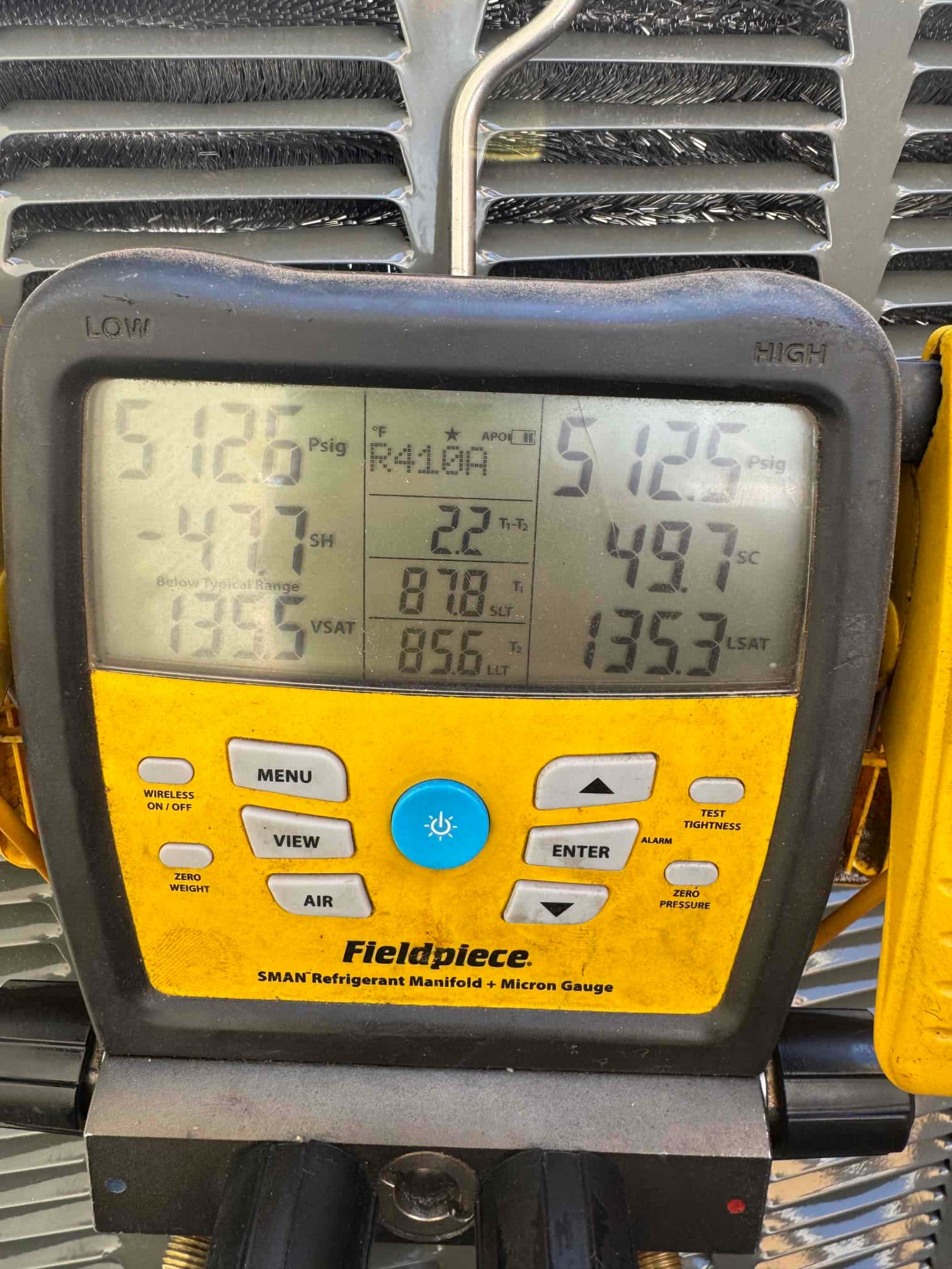 Digital manifold shows both high and low sides at 5125 psig during a nitrogen pressure test on the newly installed system.