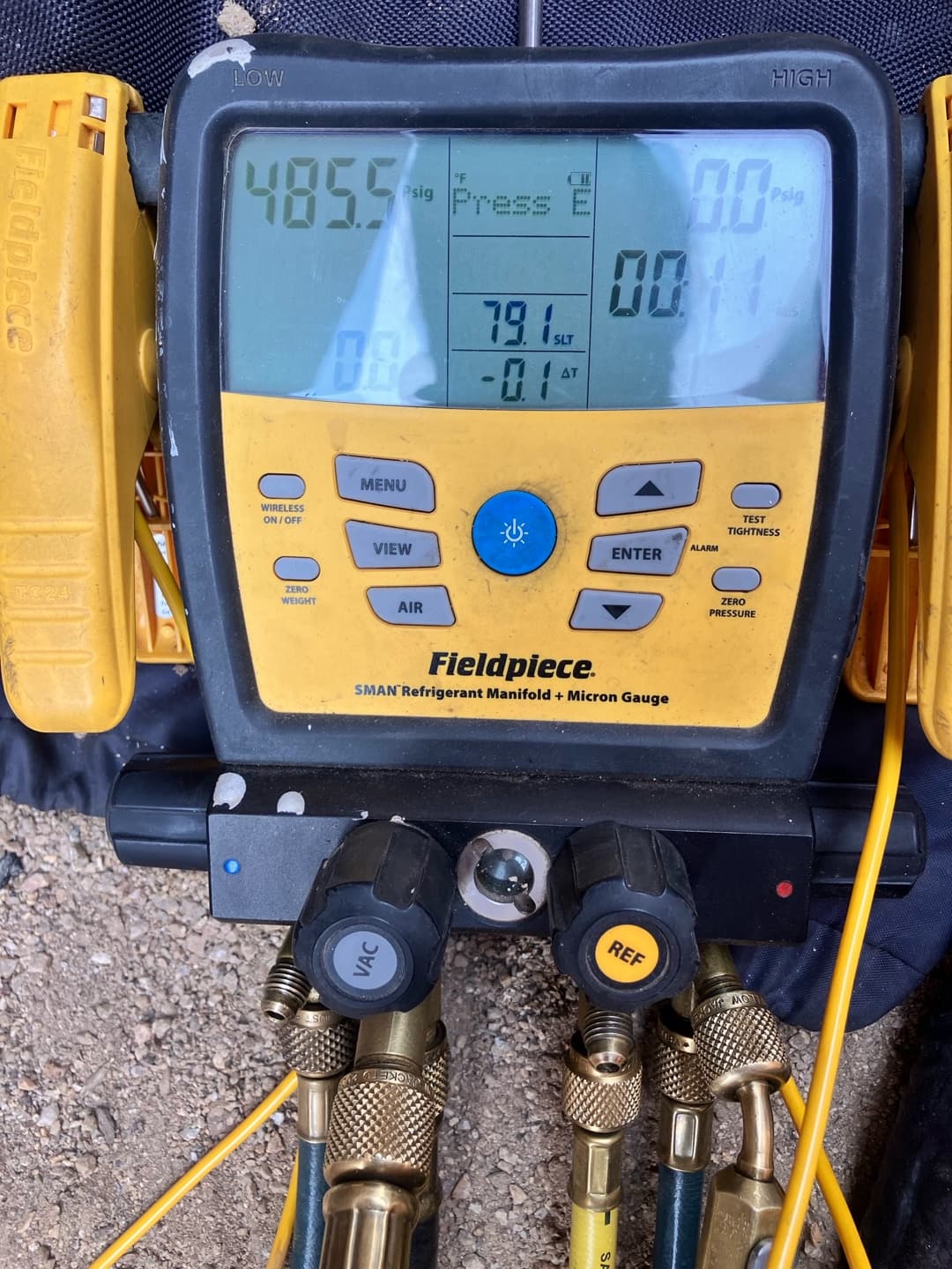 Digital manifold shows both high and low sides equalized during a nitrogen pressure test on a newly installed system.