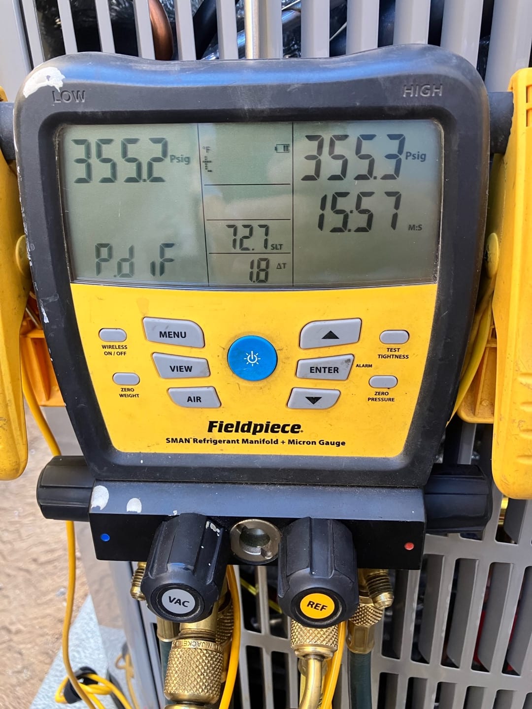 Digital manifold shows both high and low sides holding around 355 PSI during the nitrogen pressure test on the new system.